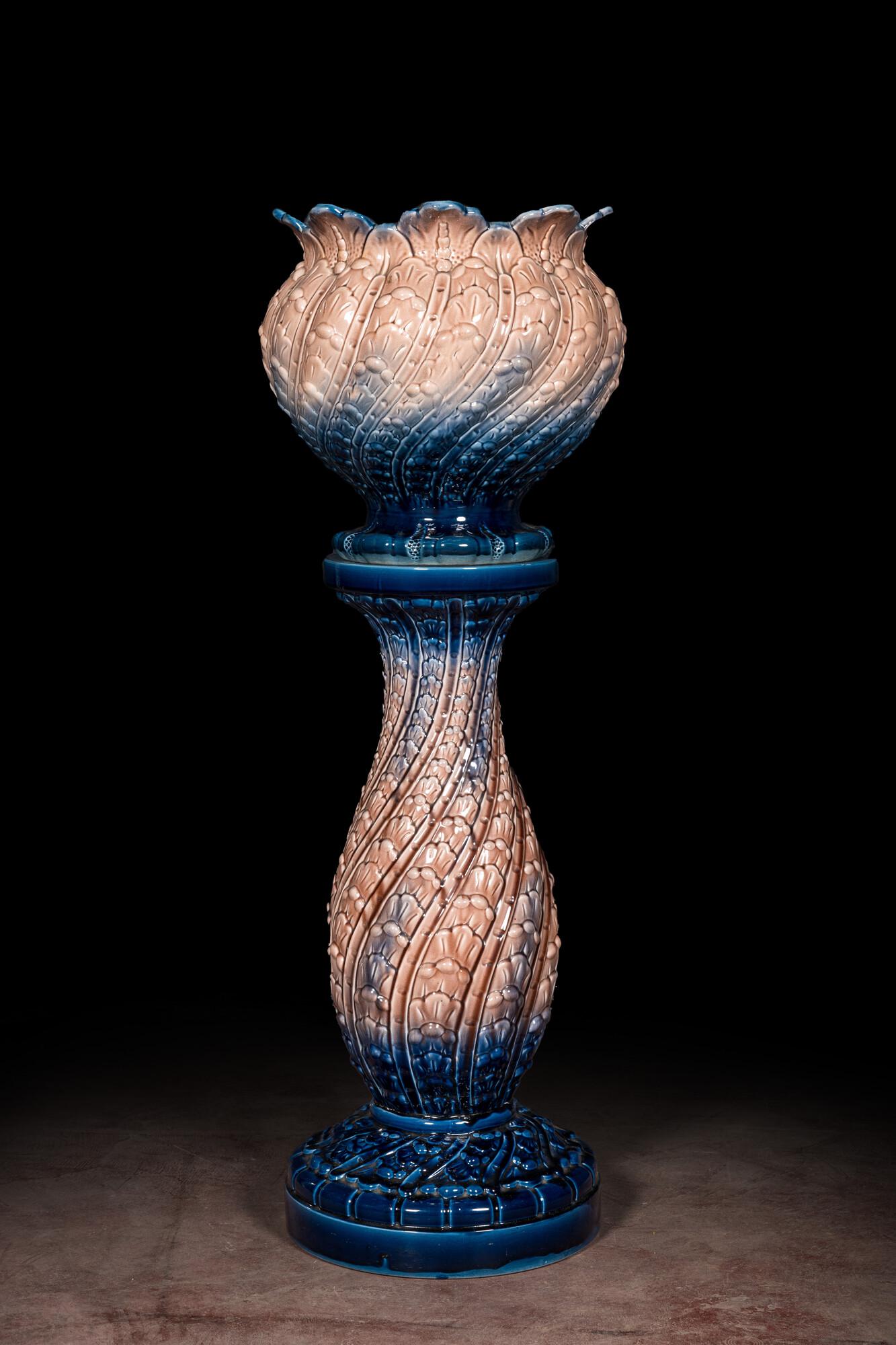 A polychrome pottery Art Nouveau jardiniÃ¨re on stand, 1st half 20th C