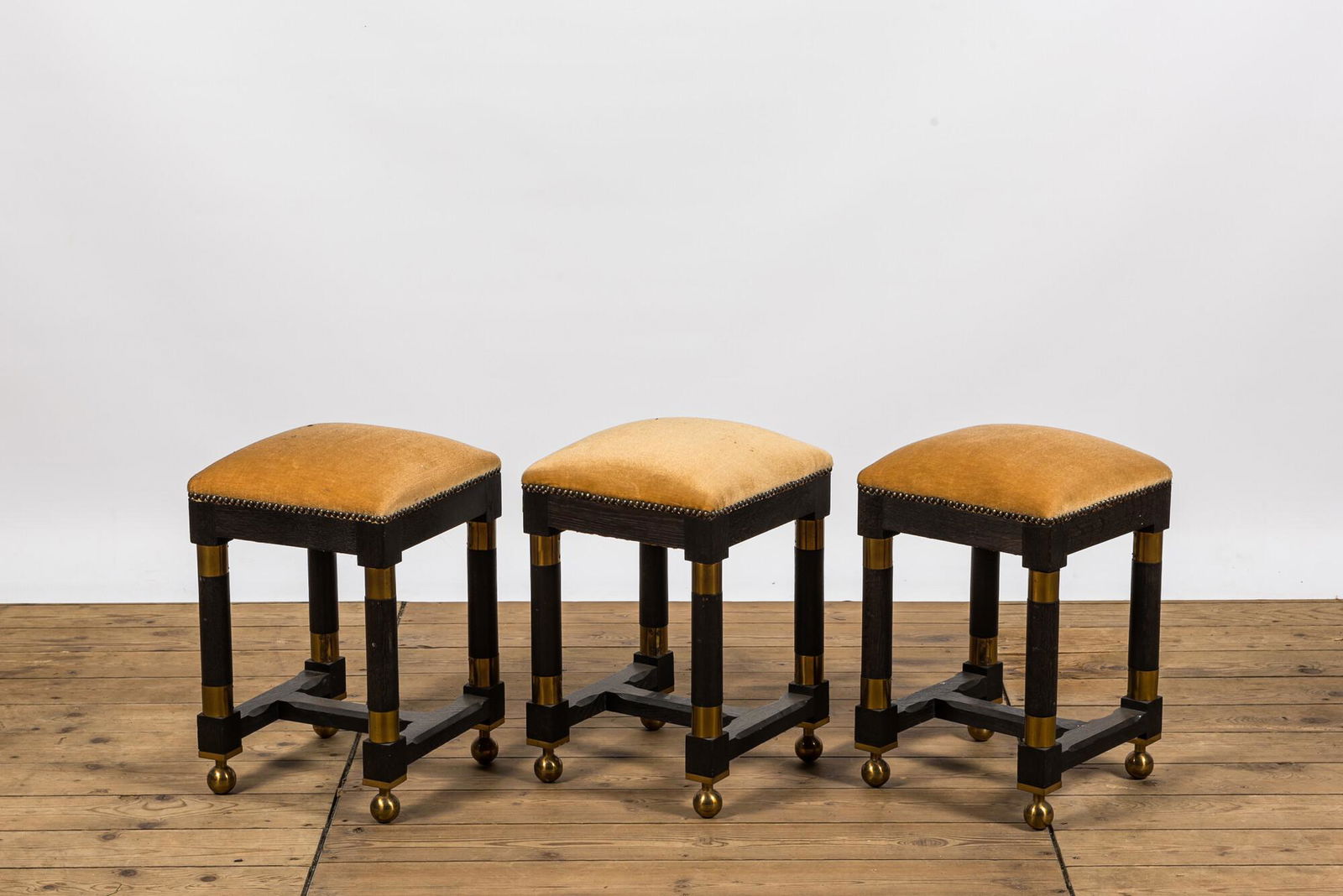 Three square black painted brass mounted wooden stools, 20th C. (1 of 2)