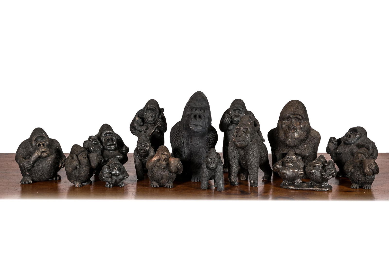 A large collection of wooden and polystone gorilla sculptures, 20th C. (1 of 2)