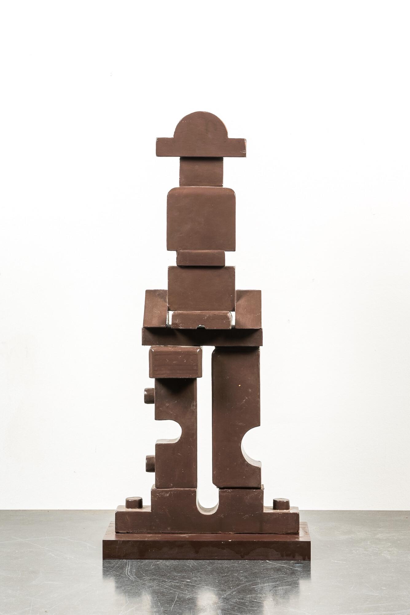 An abstract brown-painted wooden sculpture, 20th C. (1 of 3)