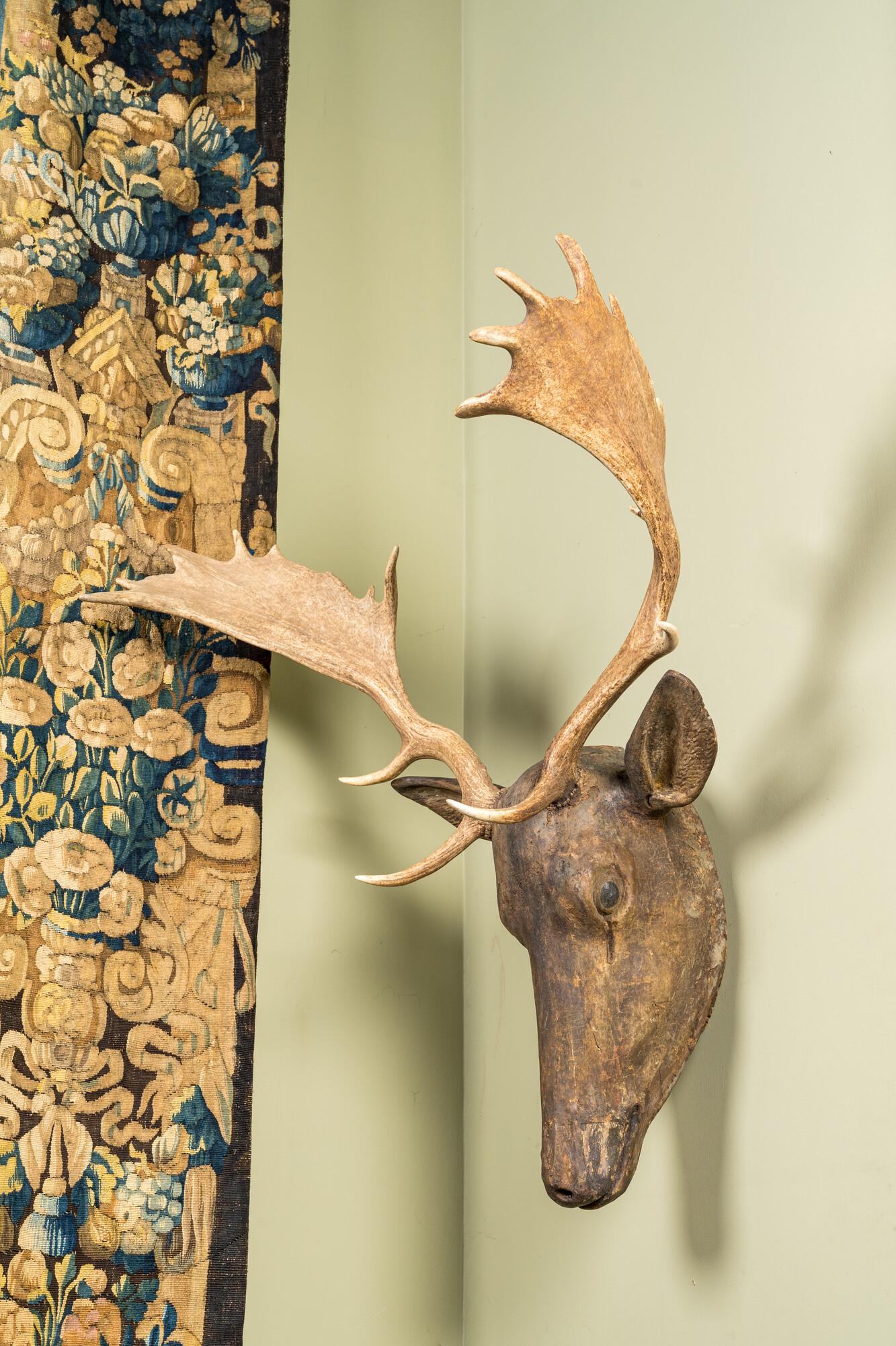 A polychrome wooden deer head with moose antlers, 19/20th C. (1 of 2)