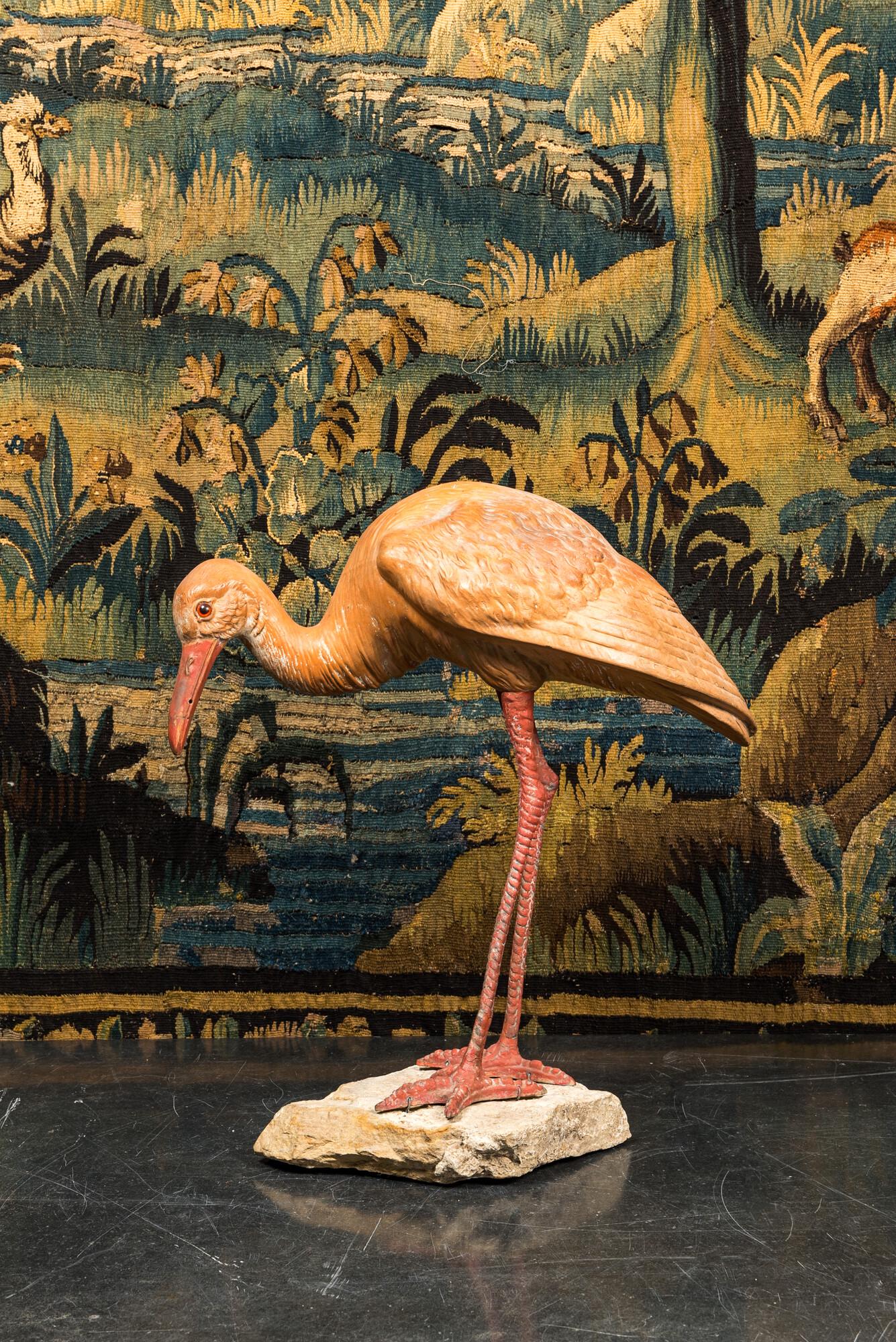 A polychrome plaster ibis on a stone base, 20th C. (1 of 2)