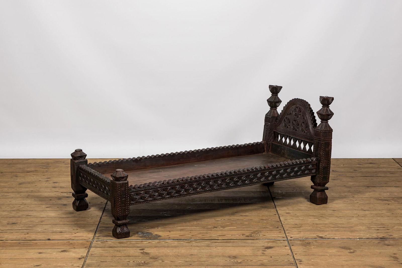 A wooden children's bed, probably Northern Africa, early 20th C. (1 of 4)