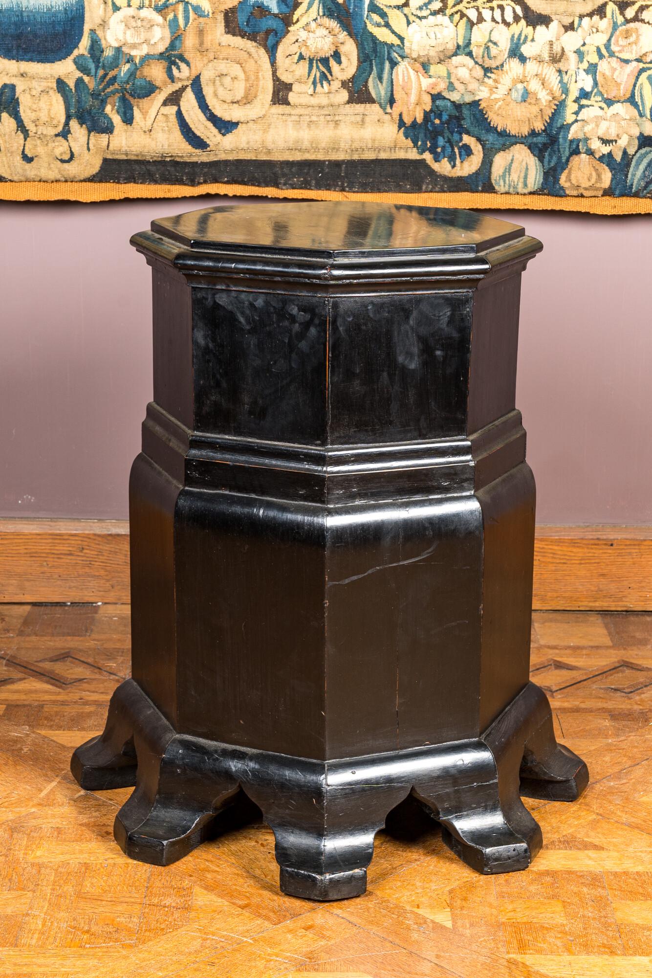 An ebonised wooden pedestal, 20th C.: Full title: An ebonised wooden pedestal, 20th C. Description: H 66 x L 57 x D 56,5 cm L 38 x D 37,5 cm (top surface) About this sale: Paul De Grande is one of the major dealers of antique furniture, f