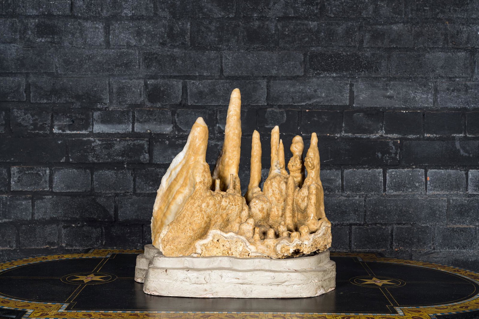 A large stalactites specimen on a painted wooden base: Full title: A large stalactites specimen on a painted wooden base Description: H 49 x L 51,5 cm About this sale: Paul De Grande is one of the major dealers of antique furniture, fine sculptures and de