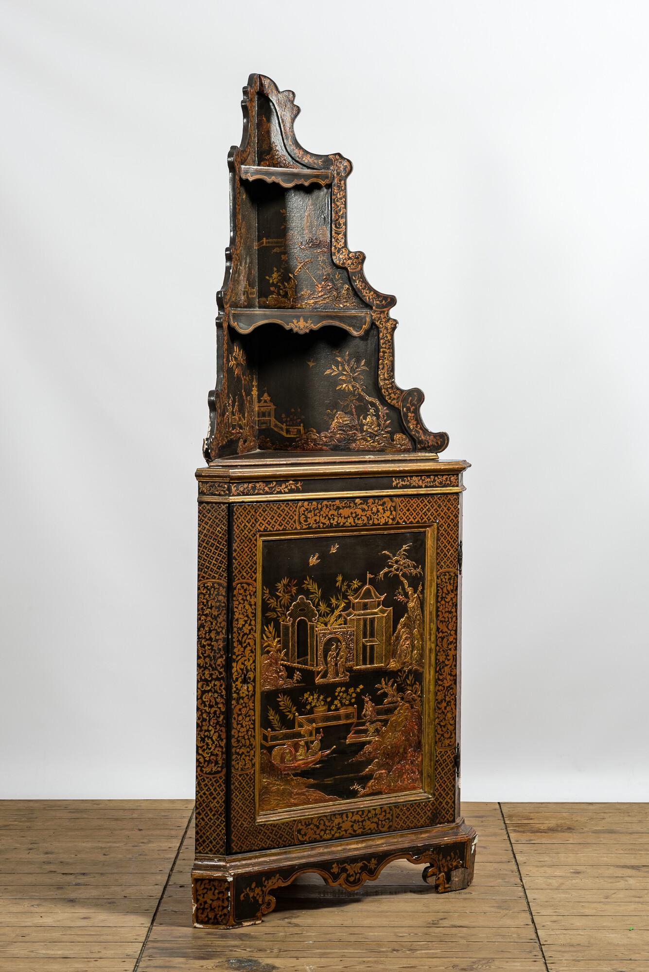 A black-lacquered and gilt chinoiserie corner cabinet, 20th C. (1 of 2)