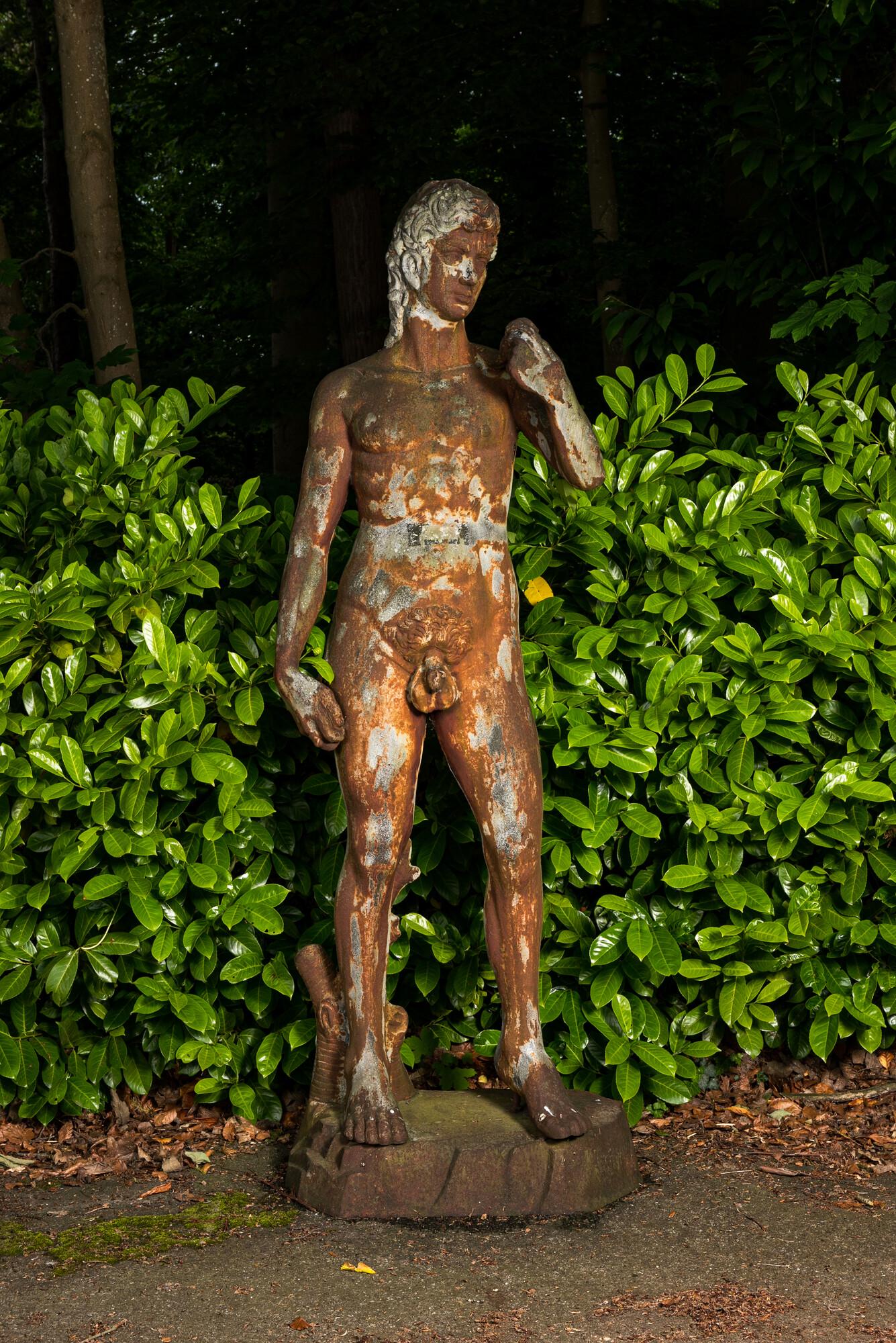 A large cast iron garden sculpture of Apollo, 20th C. (1 of 4)
