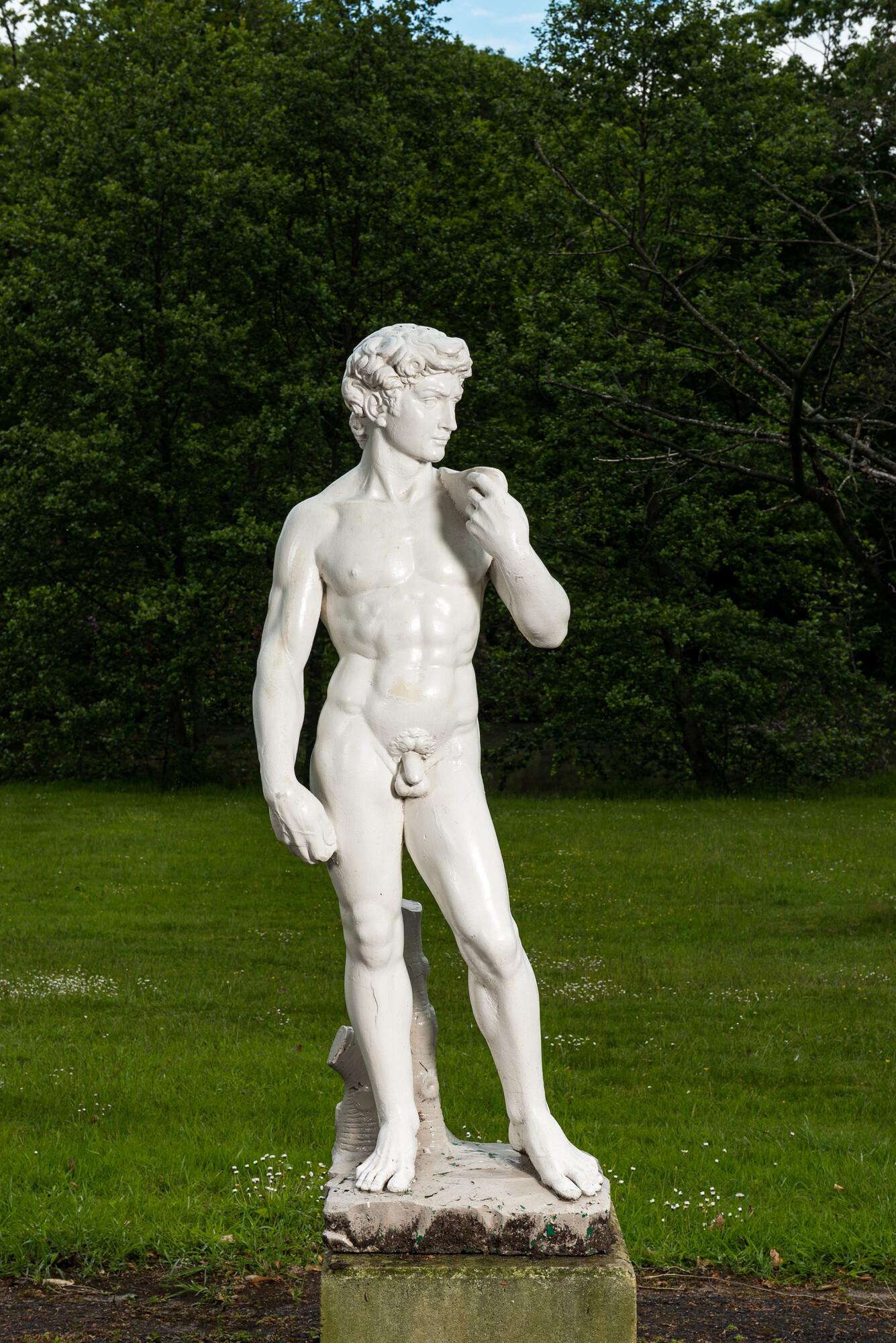 A white painted concrete sculpture of Apollo, 20th C. (1 of 3)