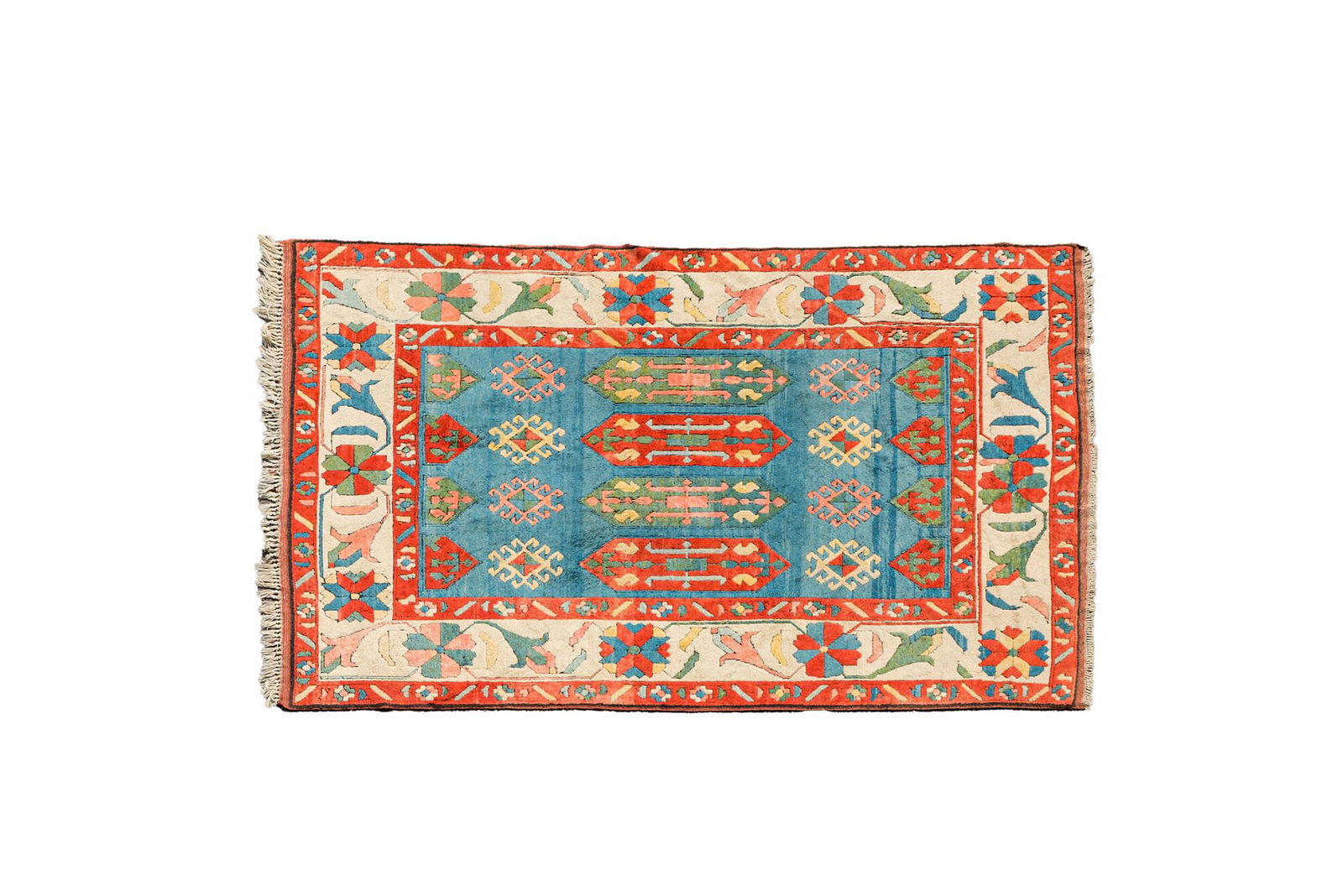 An Oriental woolen rug with floral design and geometric motifs, 20th C. (1 of 3)