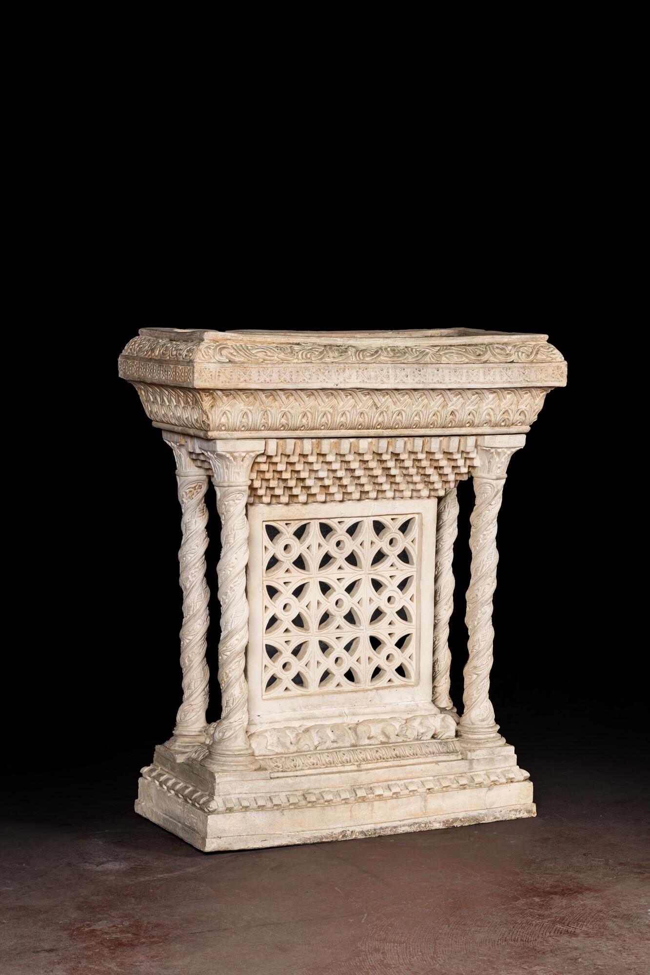 A large white patinated plaster jardiniÃ¨re in Romanesque-style, 20th C. (1 of 3)