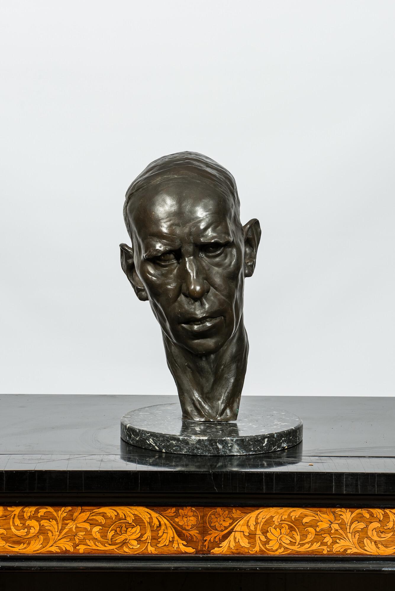 A patinated bronze head of a man on marble stand, illegibly signed and dated (19)29 (1 of 3)