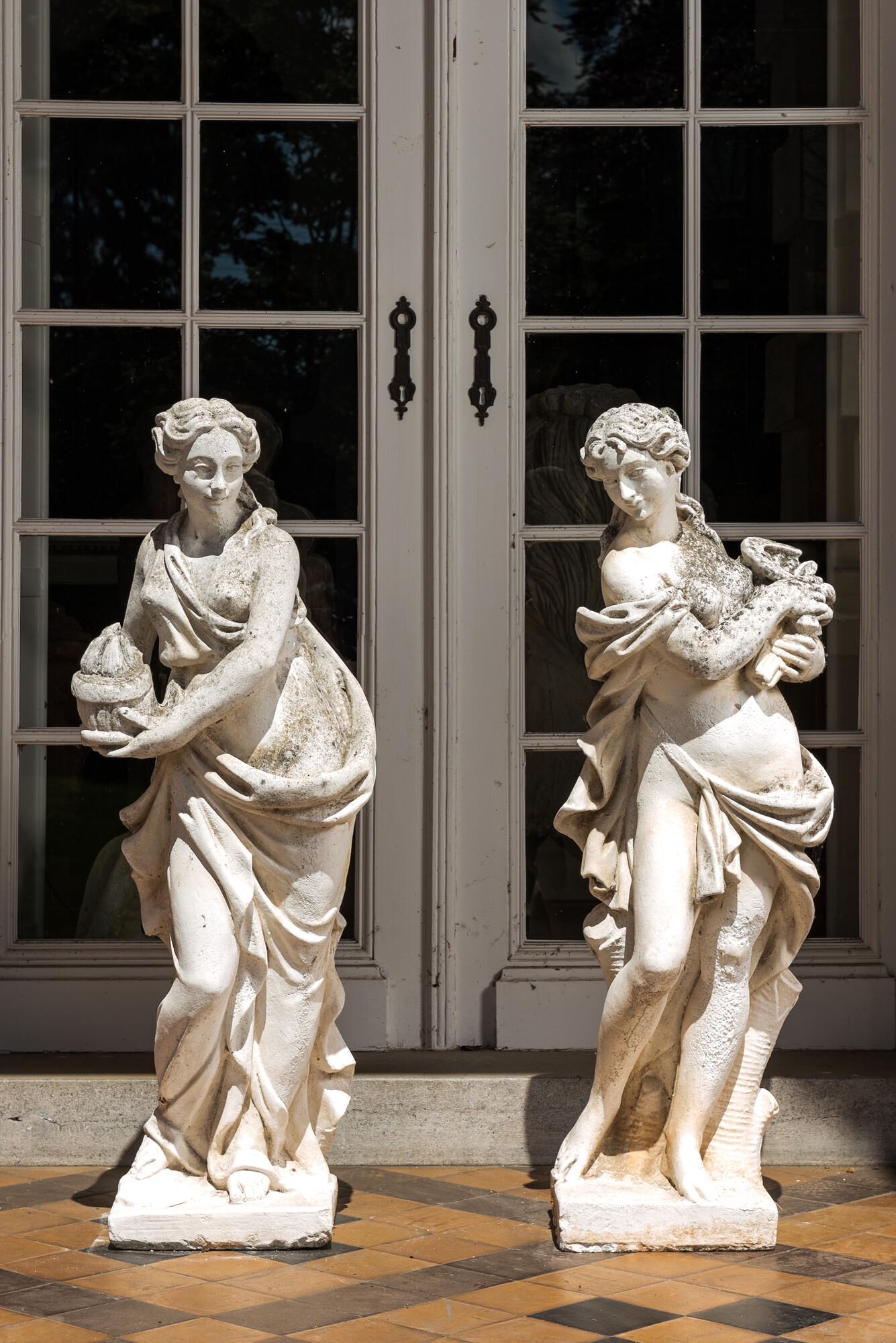 Two large white painted concrete garden statues with allegorical depictions of seasons, 20th C. (1 of 4)