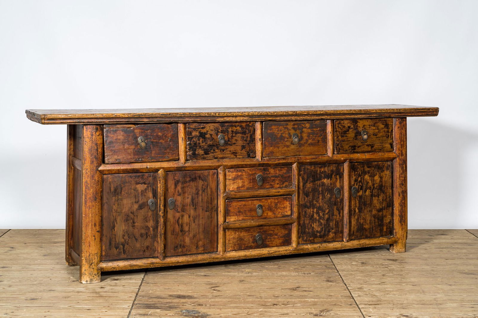 A Chinese elmwood sideboard, 19/20th C. (1 of 3)