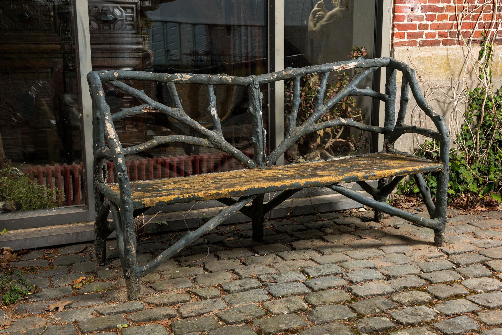A garden bench in a patinated faux bois structure, 20th C. (1 of 4)