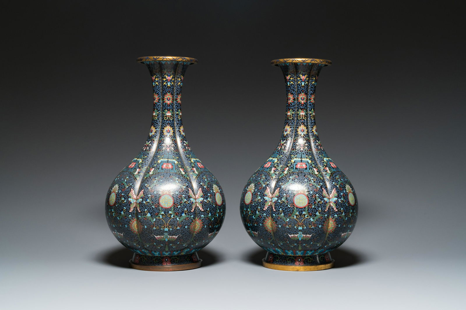 A pair of large Chinese cloisonné 'bats and shou' bottle vases, 19th C. (1 of 7)