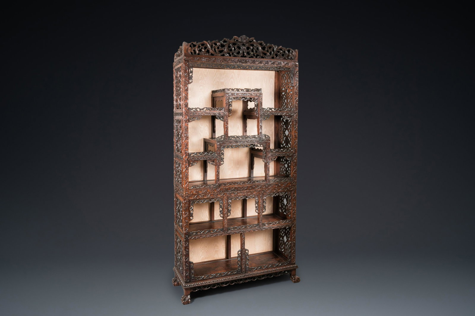 A Chinese reticulated hardwood display cabinet, 19th C.: Dim.: 215 x 104 x 39 cm