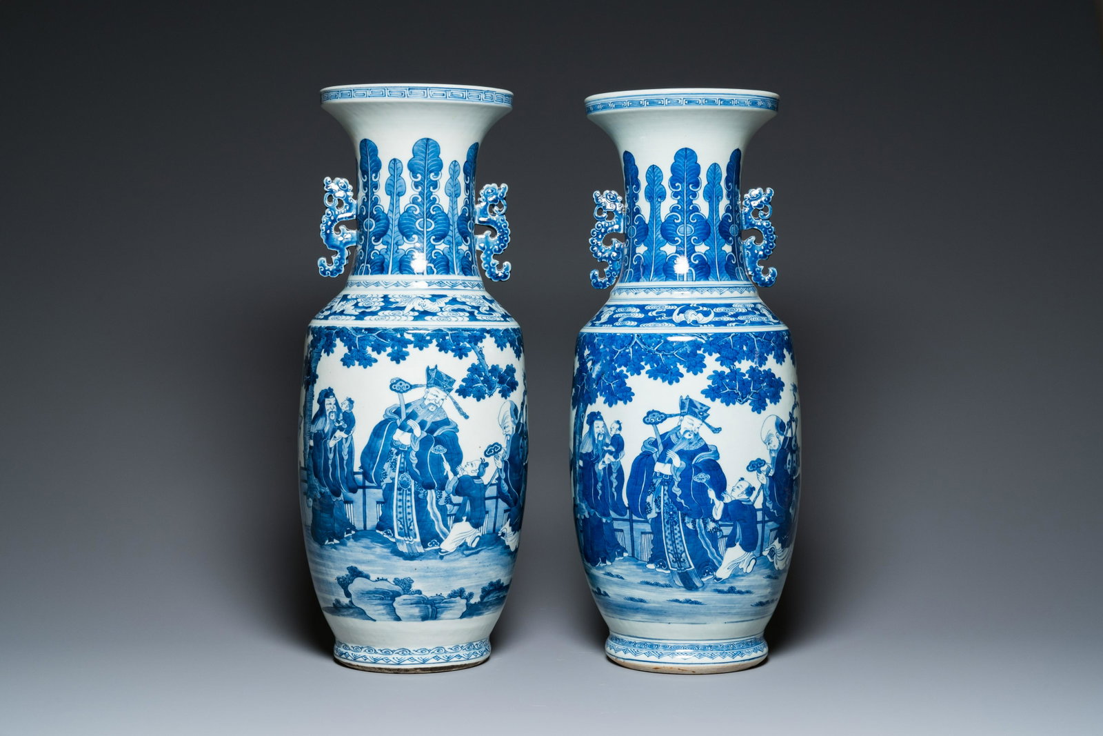 A pair of Chinese blue and white 'Sanxing' vases, Jiaqing: H.: 63,5 cm Condition: (UV-checked) - One vase in excellent condition, with a few typical superficial chips to the foot rim. - Another with a few typical superficial chips to the foot rim, and a hairl