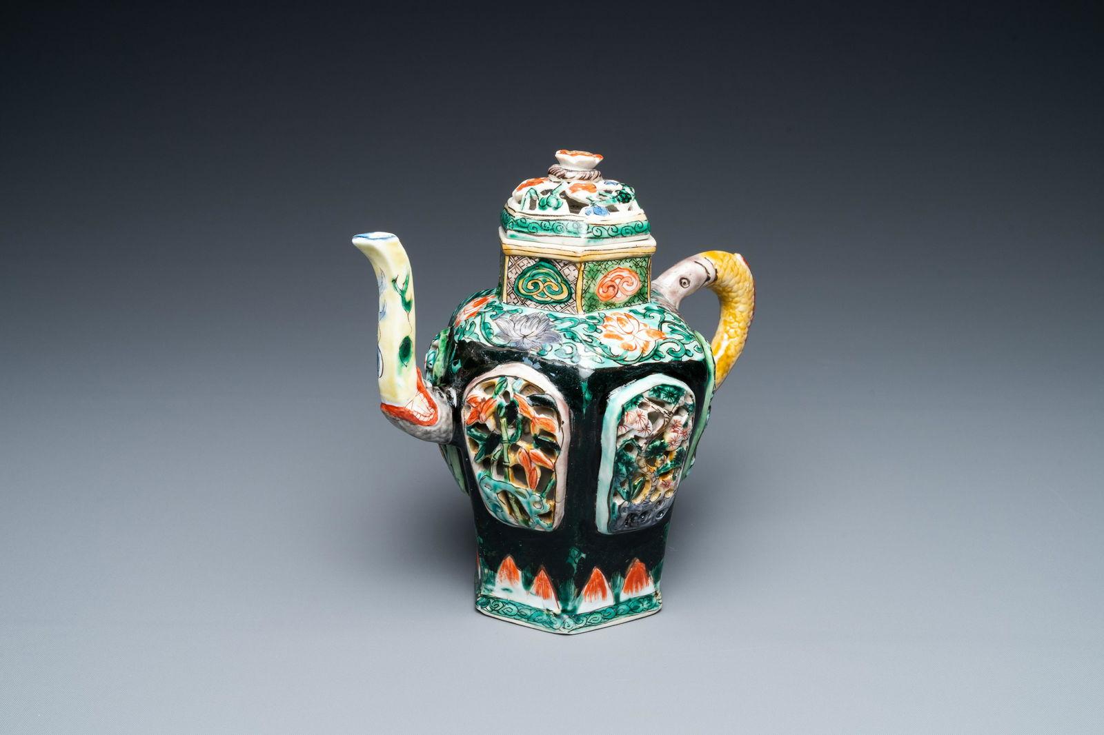 A Chinese verte biscuit reticulated teapot and cover, Kangxi (1 of 20)