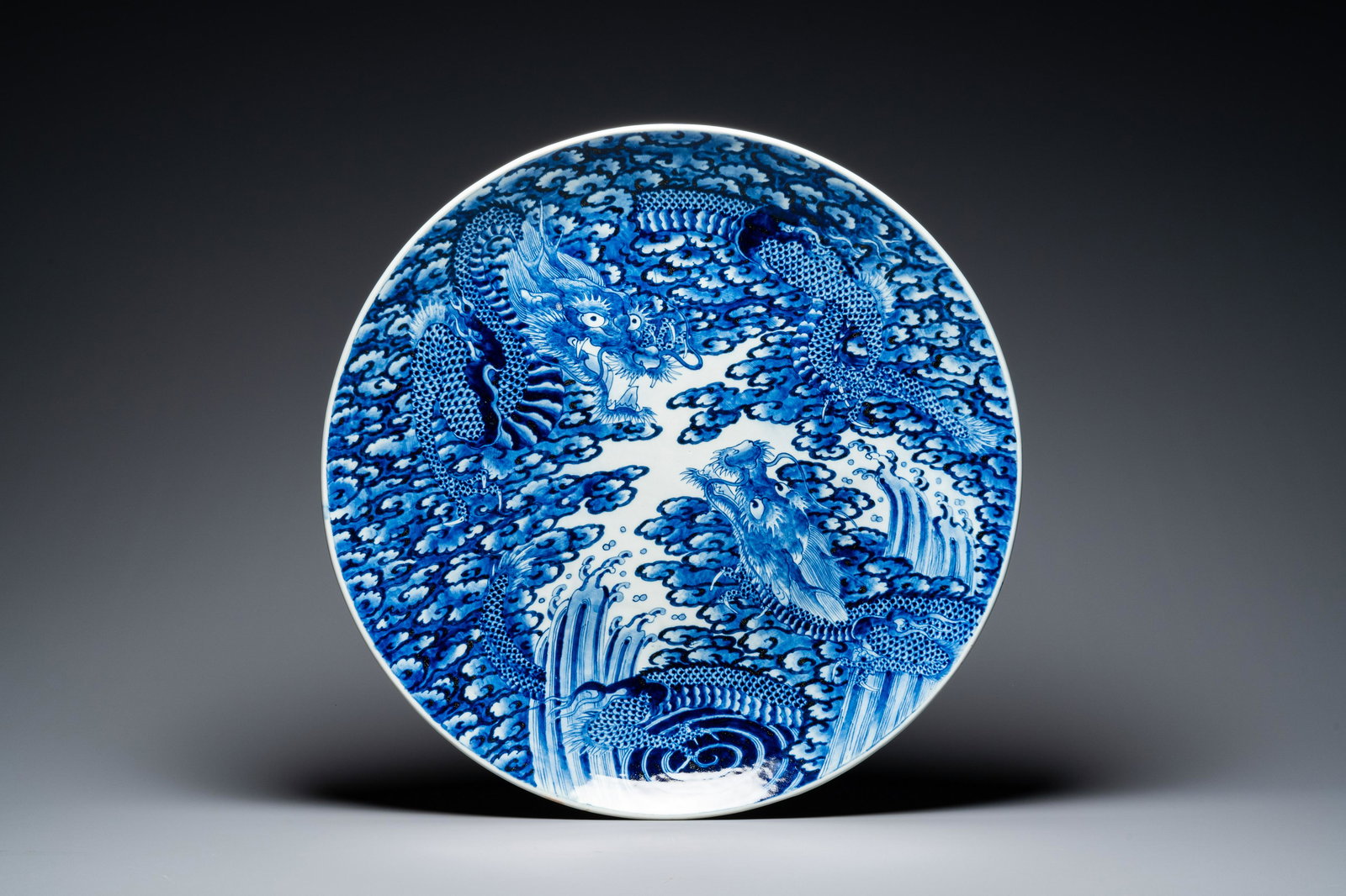 An exceptionally large blue and white Japanese Arita 'dragon' dish, 19th C.: Dia.: 61 cm