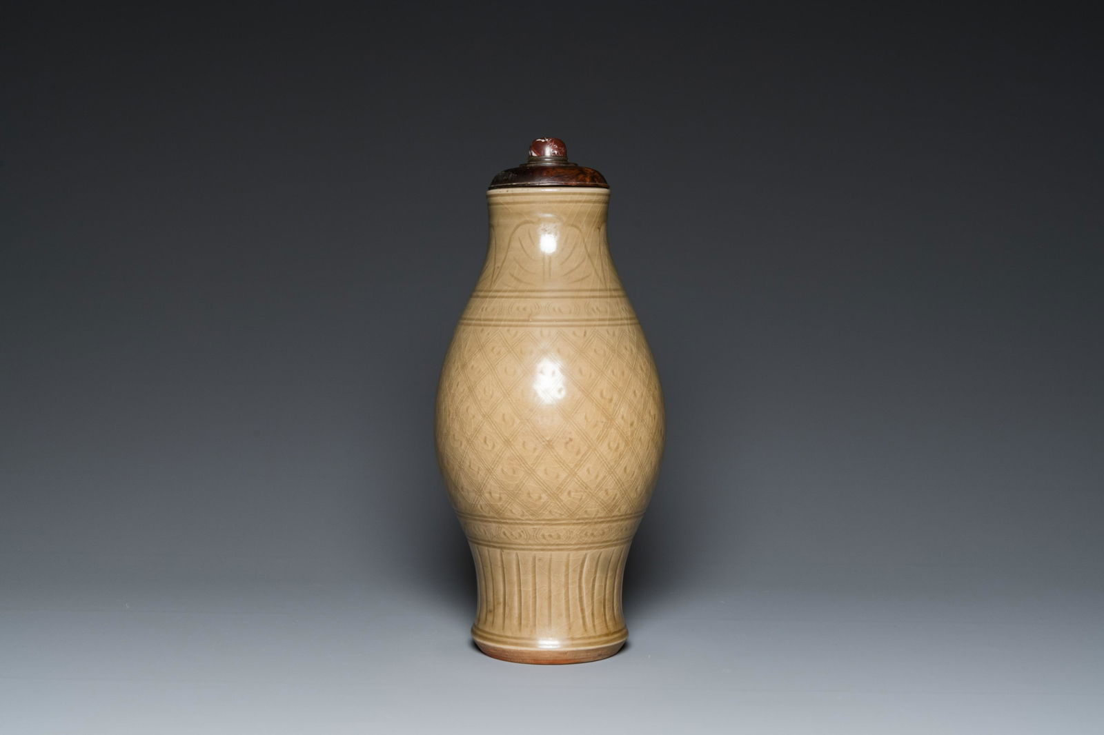 A Chinese Longquan celadon vase with underglaze design, Yuan or later (1 of 18)