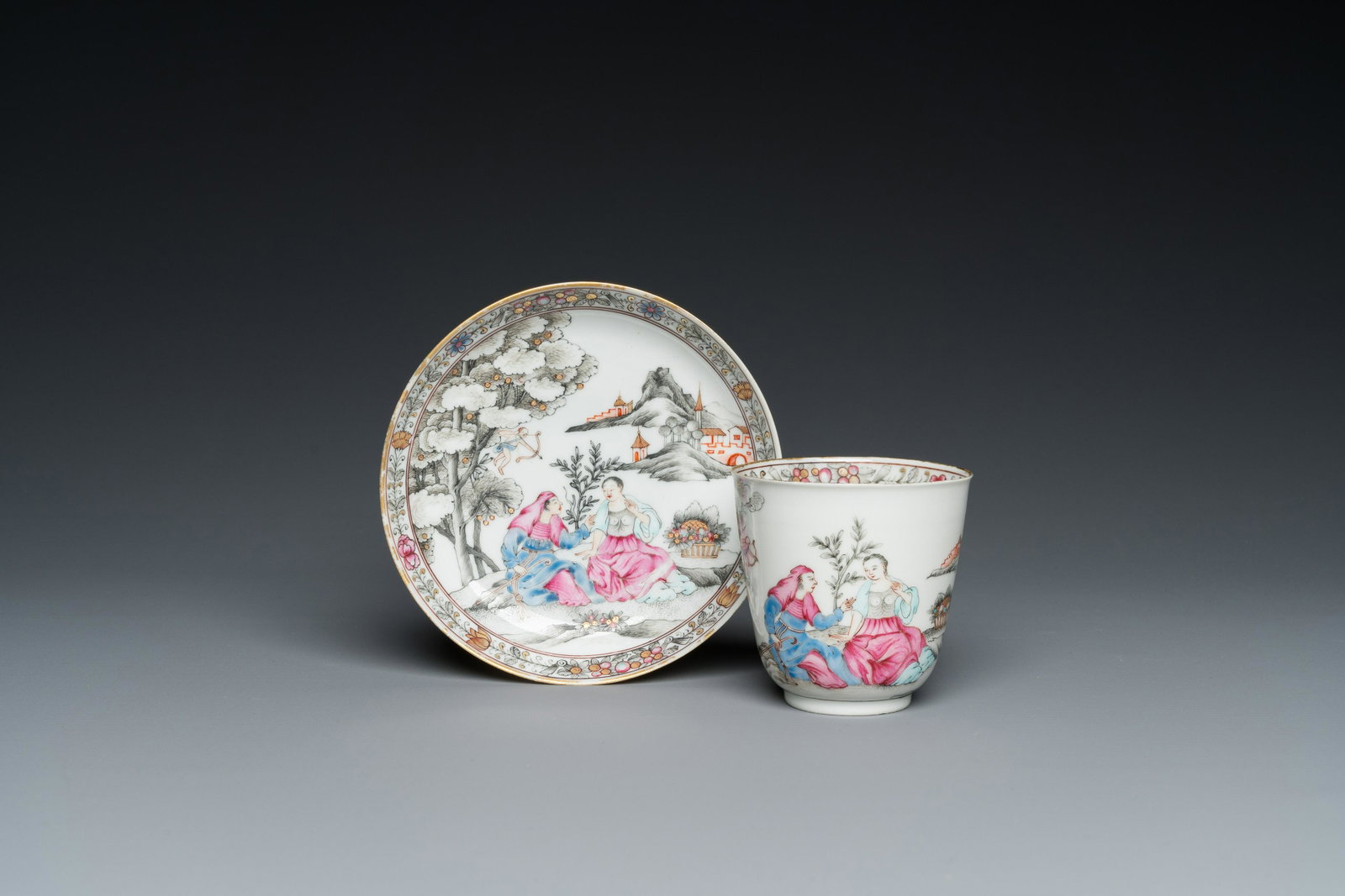 A Chinese famille rose 'erotical subject' cup and saucer, Yongzheng/Qianlong: Dia.: 13 cm (the saucer) H.: 7,5 cm - Dia.: 7,5 cm (the cup) Condition: (UV-checked) - The cup with a break reglued of ca. 5 x 2 cm to the rim. - The saucer in excellent condition. 品相