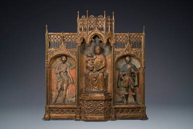 A large Spanish gilt and polychromed wooden tryptich retable with Saint John the Baptist, the Virgin
