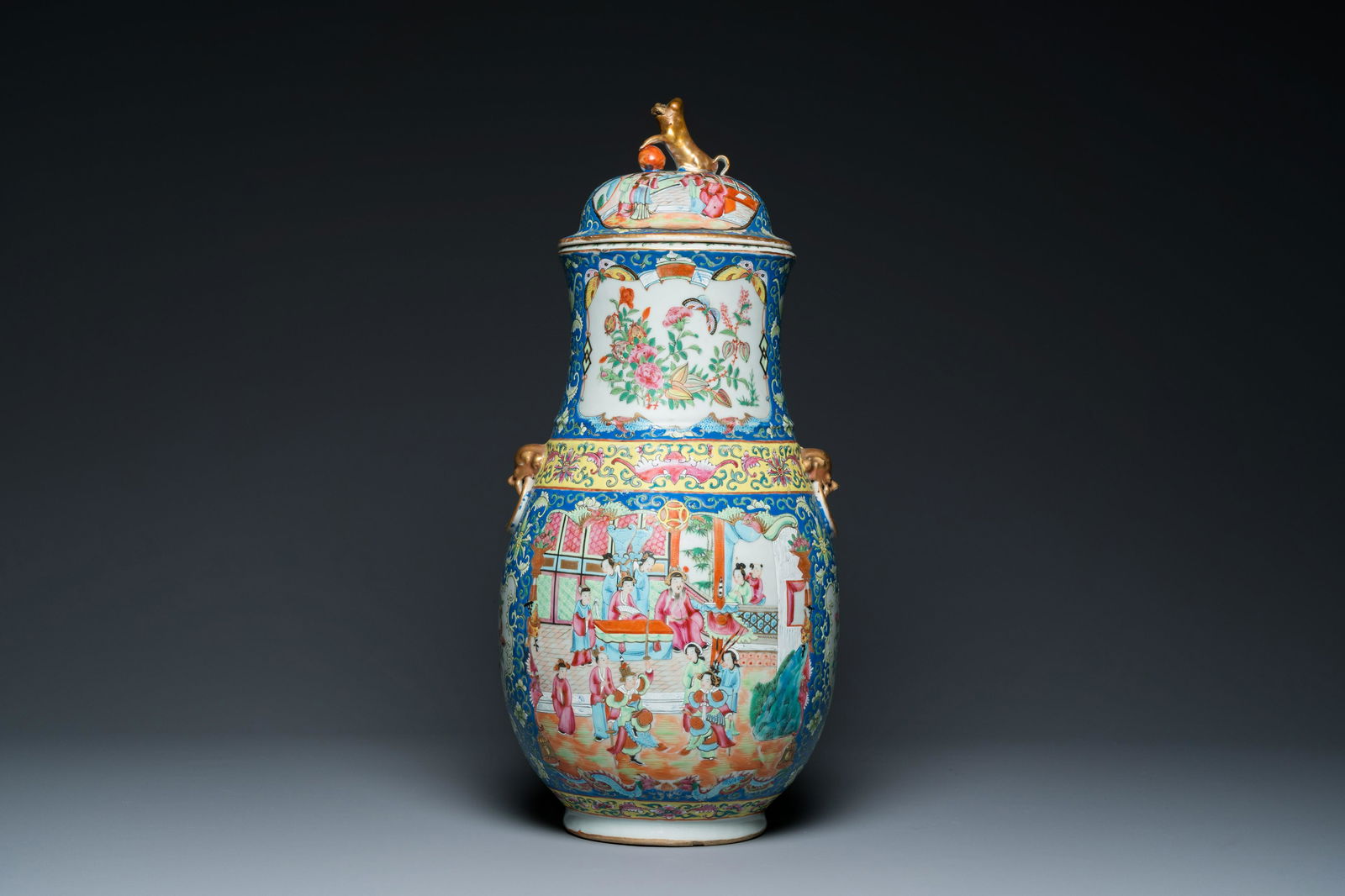 A Chinese Canton famille rose blue-ground vase and cover, 19th C. (1 of 6)
