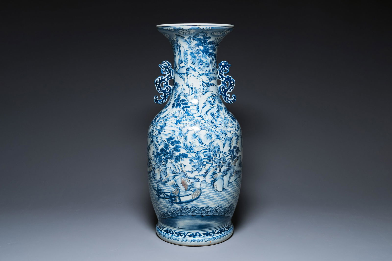 A large Chinese blue, white and copper-red vase with a mountainous river landscape, 19th C. (1 of 6)