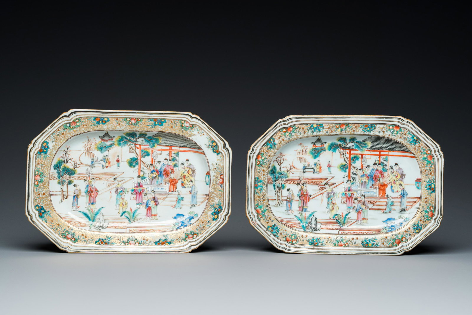 A pair of Chinese octagonal famille rose 'mandarin subject' dishes, Qianlong: Full title: A pair of Chinese octagonal famille rose 'mandarin subject' dishes, Qianlong Description: L.: 28 cm