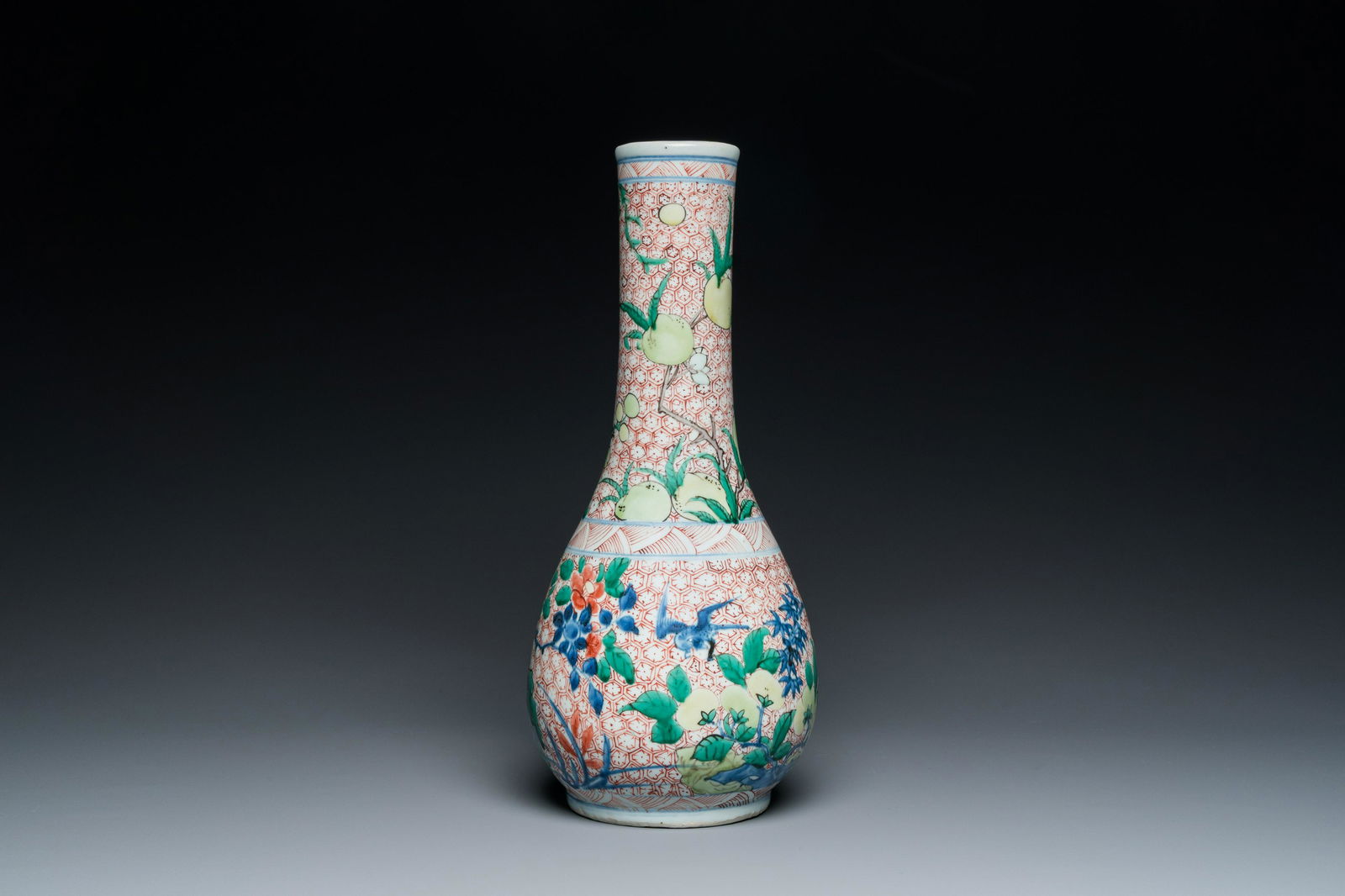 A Chinese wucai bottle vase with birds surrounded by fruits and foliage, Transitional period (1 of 6)