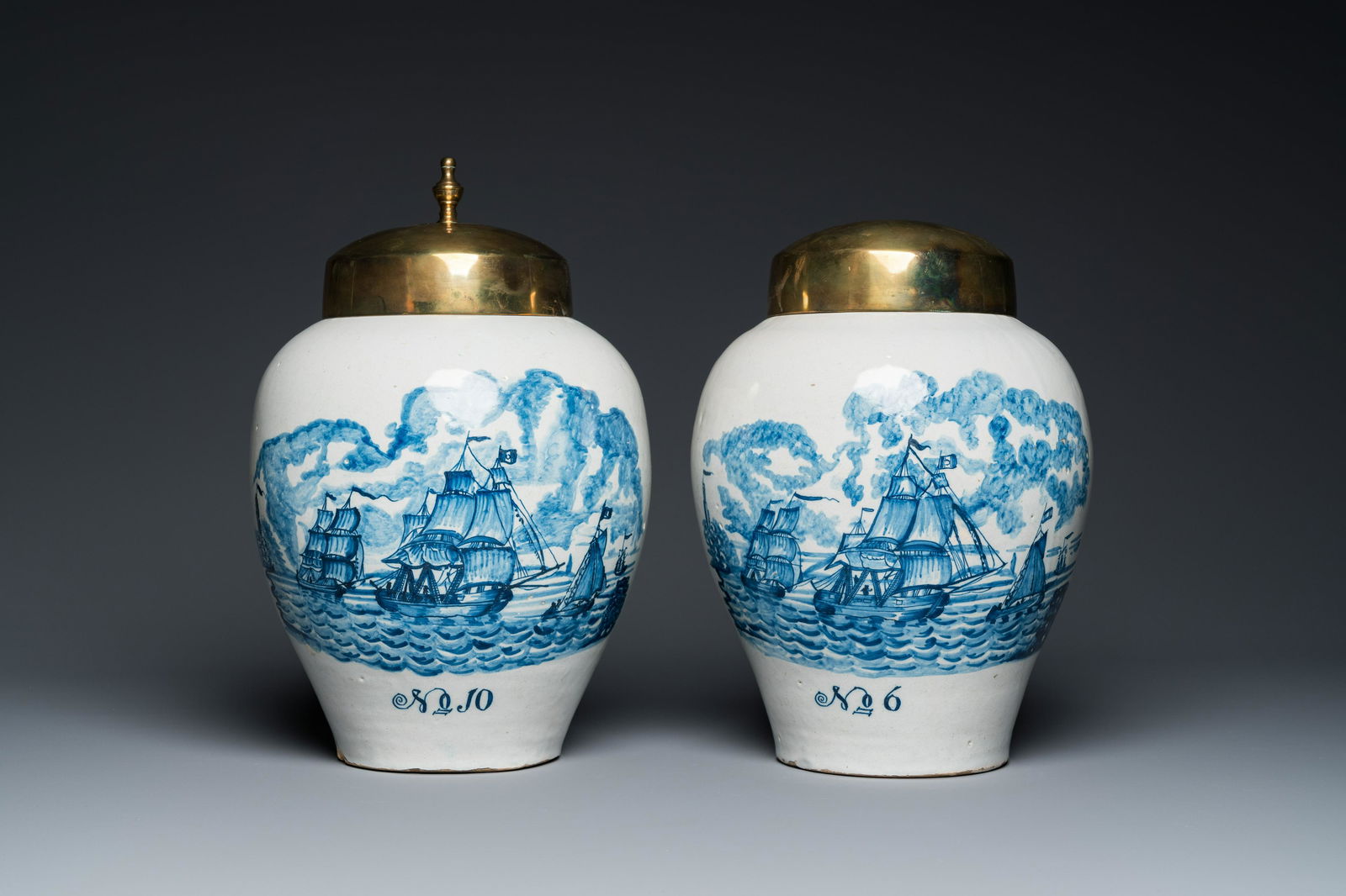 A pair of rare Dutch Delft blue and white 'maritime subject' tobacco jars with brass covers, 18th C. (1 of 7)