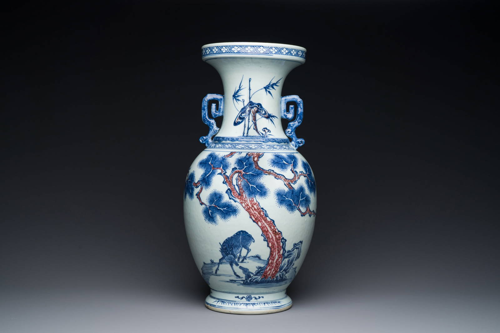 A Chinese Blue, White And Copperred Vase With Two Deer Near A Pine