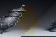 An extremely rare and important Chinese archaic bronze ritual wine vessel and cover, 'You'