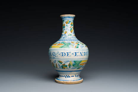 A rare polychrome Antwerp maiolica pharmacy bottle inscribed AQ DE ENDIV, middle of the 16th C.: Full title: A rare polychrome Antwerp maiolica pharmacy bottle inscribed AQ DE ENDIV, middle of the 16th C. Description: H.: 22,5 cm Condition: The absence of a condition report does not imply that a