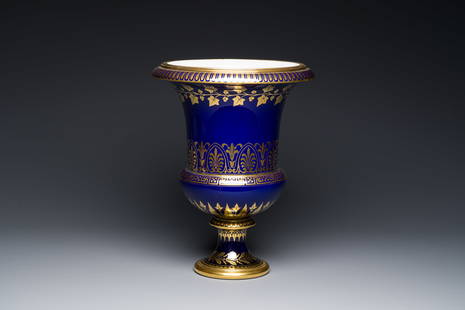 A Sevres porcelain Medici vase with gilt decoration on a vibrant blue ground, France, dated 1847 and: Full title: A Sevres porcelain Medici vase with gilt decoration on a vibrant blue ground, France, dated 1847 and 1853 Description: H.: 38,5 cm - Dia.: 30 cm The base with a Sevres 1847 mark, as