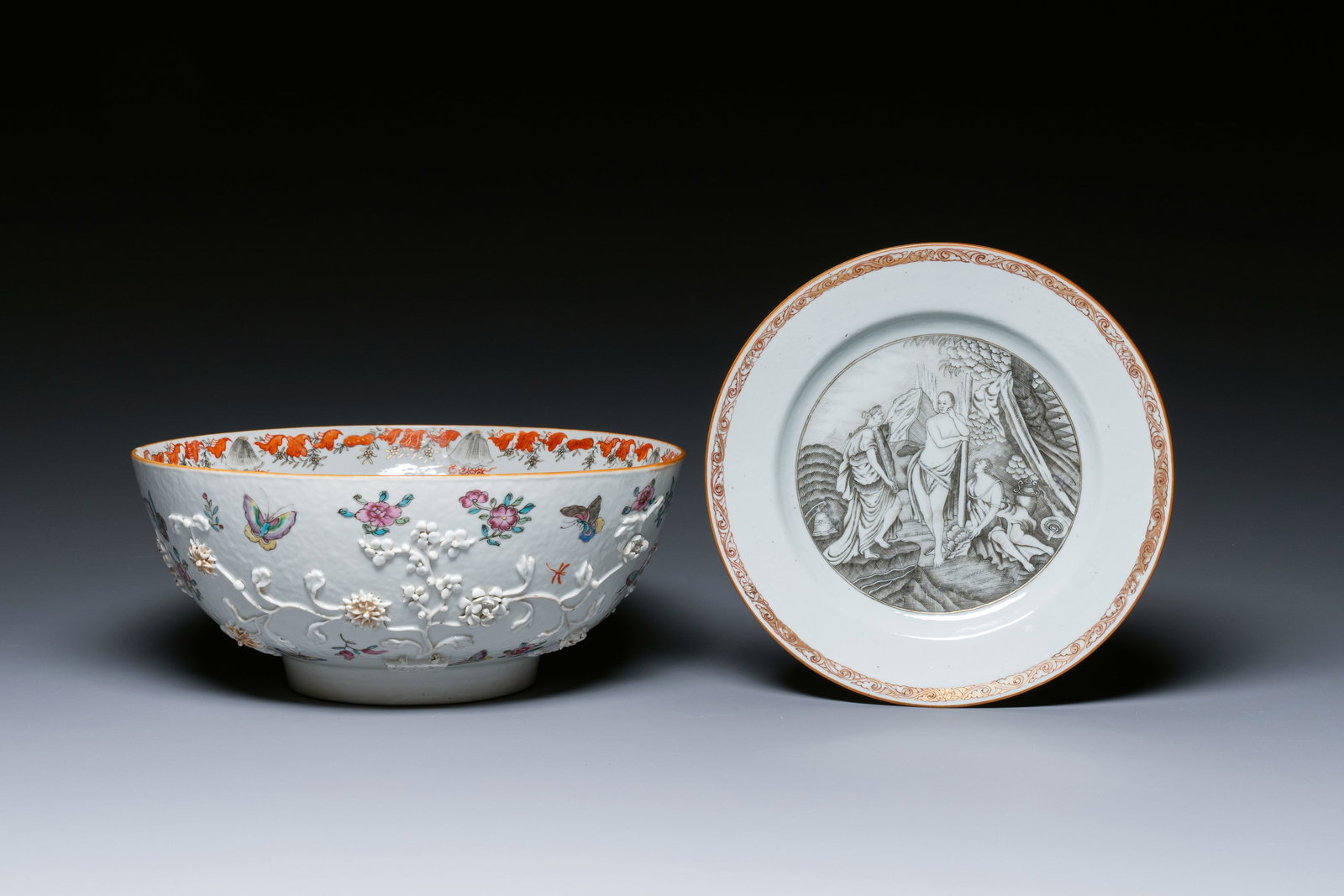 A Chinese 'mythological subject' grisaille plate and a relief-decorated famille rose 'insects' bowl,: Full title: A Chinese 'mythological subject' grisaille plate and a relief-decorated famille rose 'insects' bowl, Qianlong Description: Dia.: 27,5 cm - H.: 12 cm (the bowl) Dia.: 23 cm (the plate) The 