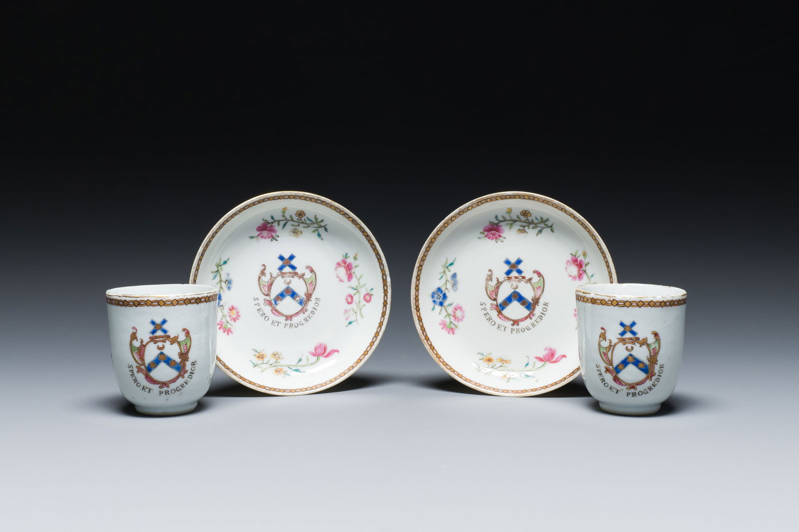 A pair of Chinese famille rose English market cups and saucers with the arms of Pringle of Whytbank,: Full title: A pair of Chinese famille rose English market cups and saucers with the arms of Pringle of Whytbank, Qianlong Description: Dia.: 12 cm (the saucer) H.: 6,5 cm (the cup) Ref: - Bonhams, Lon
