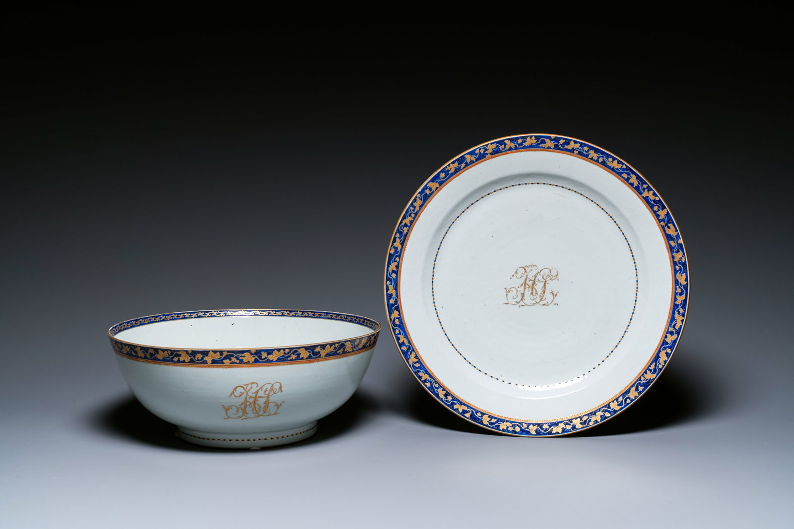 A large Chinese monogrammed export porcelain punchbowl and dish, Qianlong/Jiaqing: Full title: A large Chinese monogrammed export porcelain punchbowl and dish, Qianlong/Jiaqing Description: Dia.: 40,5 cm (the dish) Dia.: 37 cm - H.: 14,5 cm (the bowl) Condition reports (unless other