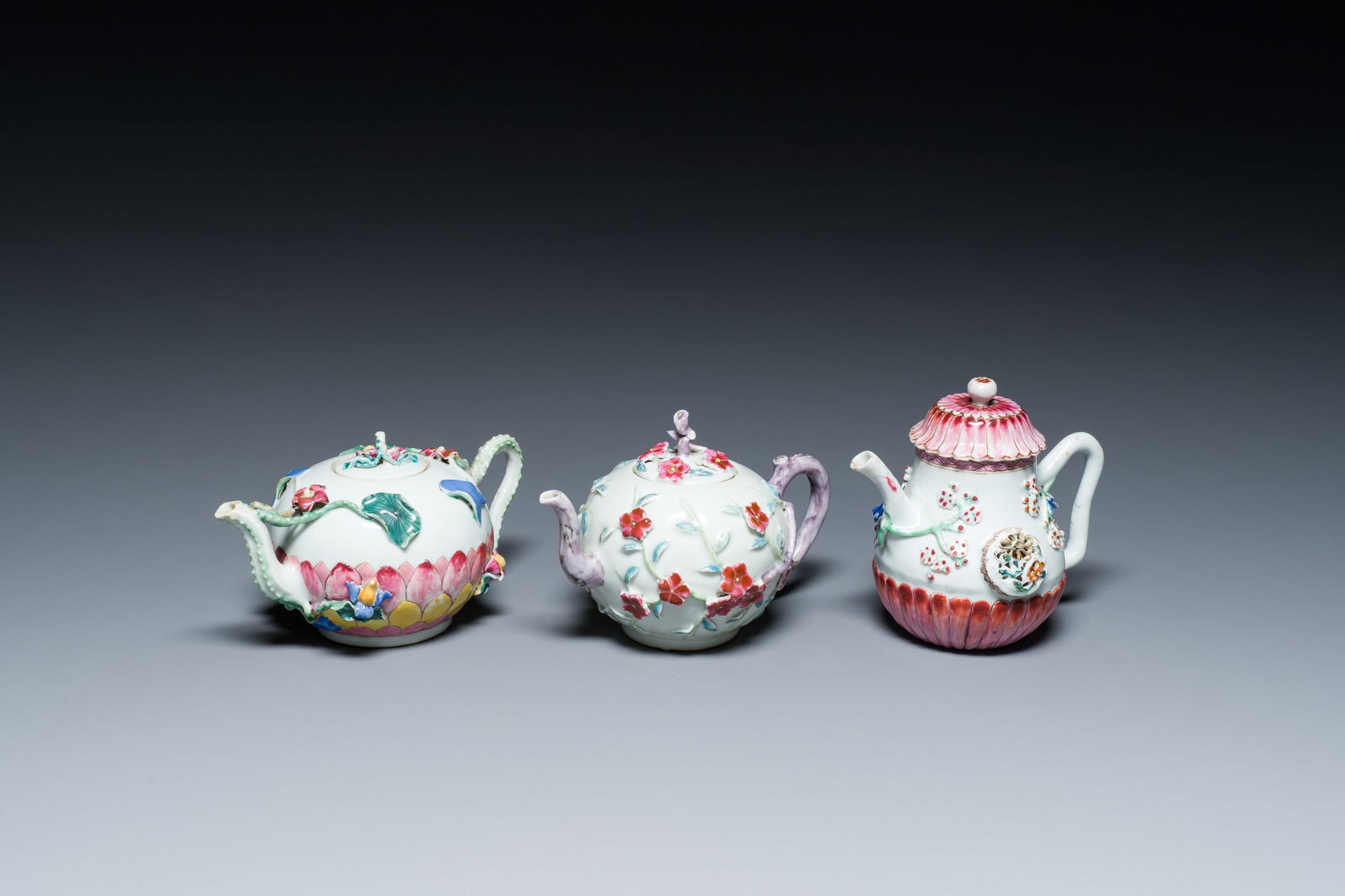 Three Chinese famille rose teapots and covers with applied floral design, Yongzheng (1 of 7)