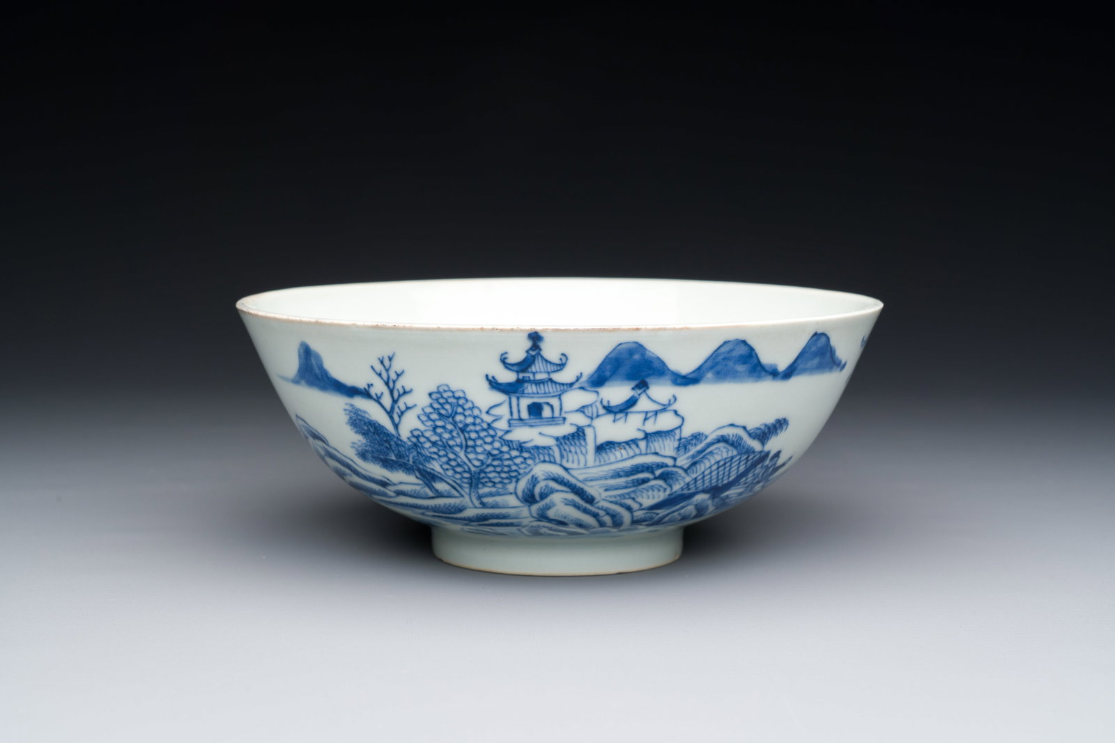 A Chinese blue and white 'Bleu de Hue' bowl with a poem in Nôm script for the Vietnamese market,: Full title: A Chinese blue and white 'Bleu de Hue' bowl with a poem in Nôm script for the Vietnamese market, Nhat markfor the Minh Mang emperor, 1820-1841 Description: Dia.: 17 cm - H.: 7 cm Provenan