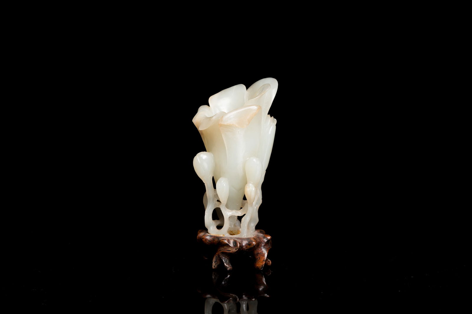 A Chinese white jade 'magnolia' carving, Qing (1 of 7)