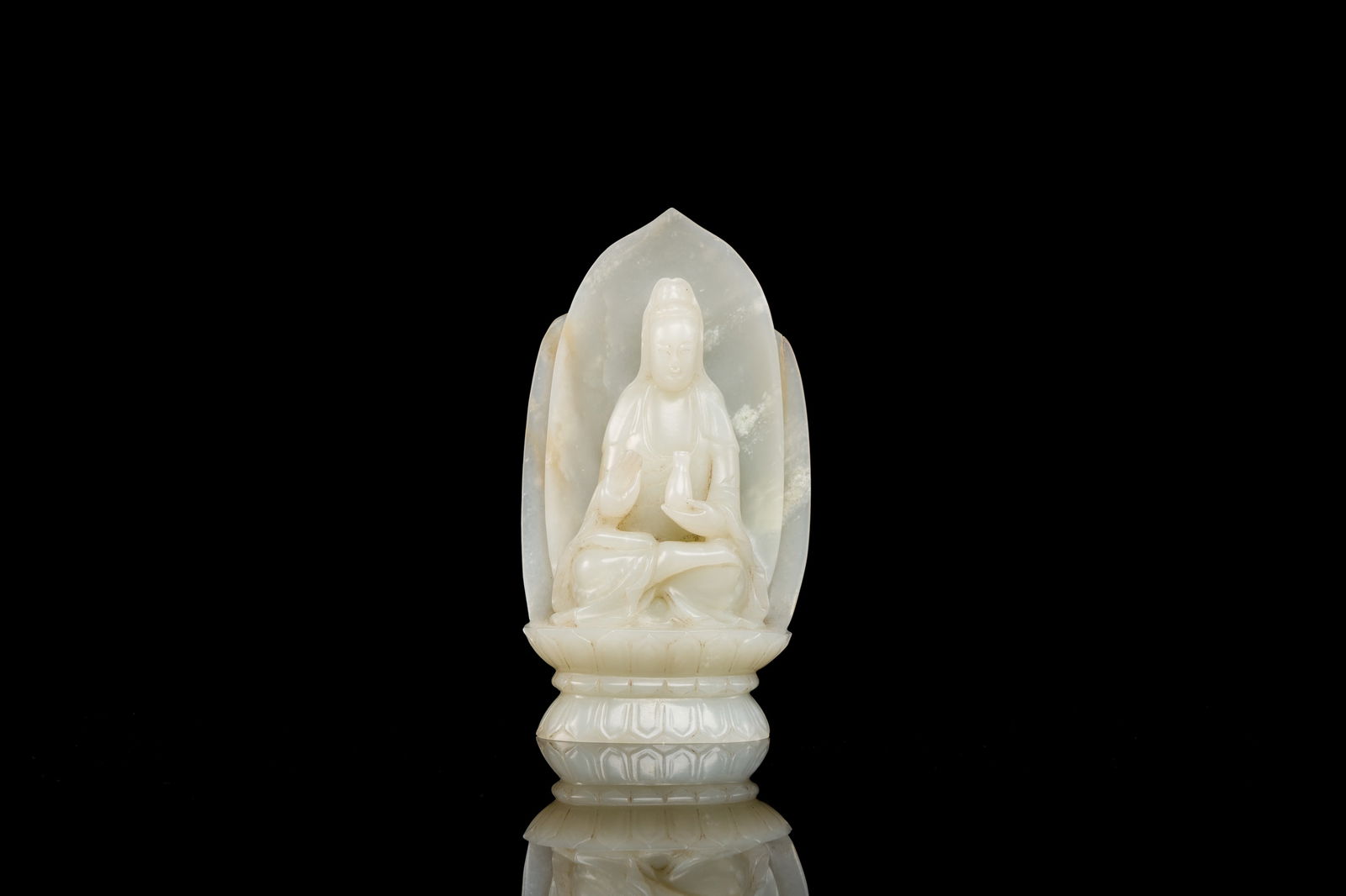 A Chinese white jade sculpture of Guanyin on a lotus throne, Qing (1 of 7)
