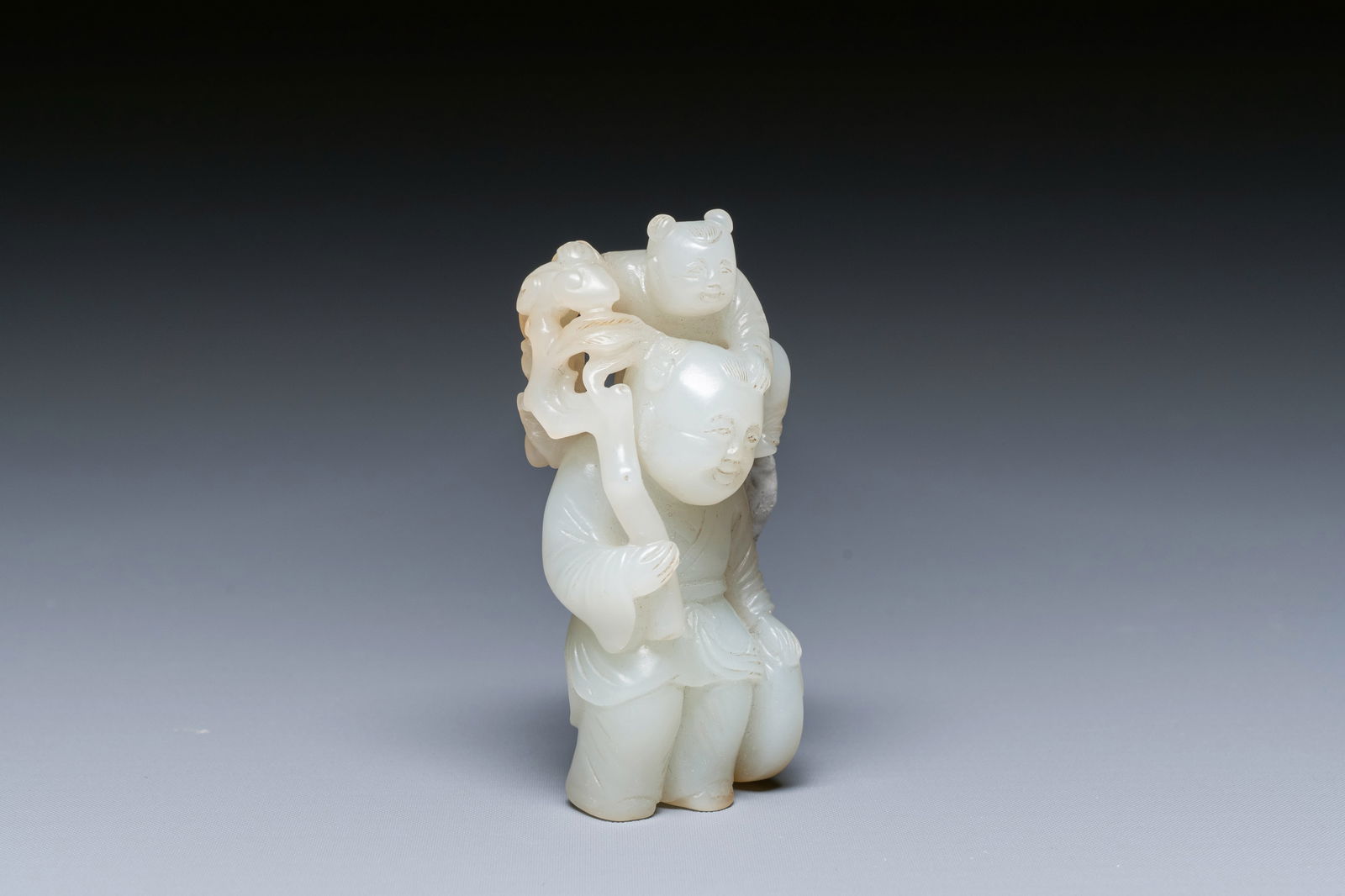 A Chinese white and russet jade sculpture of two boys, Qing (1 of 7)