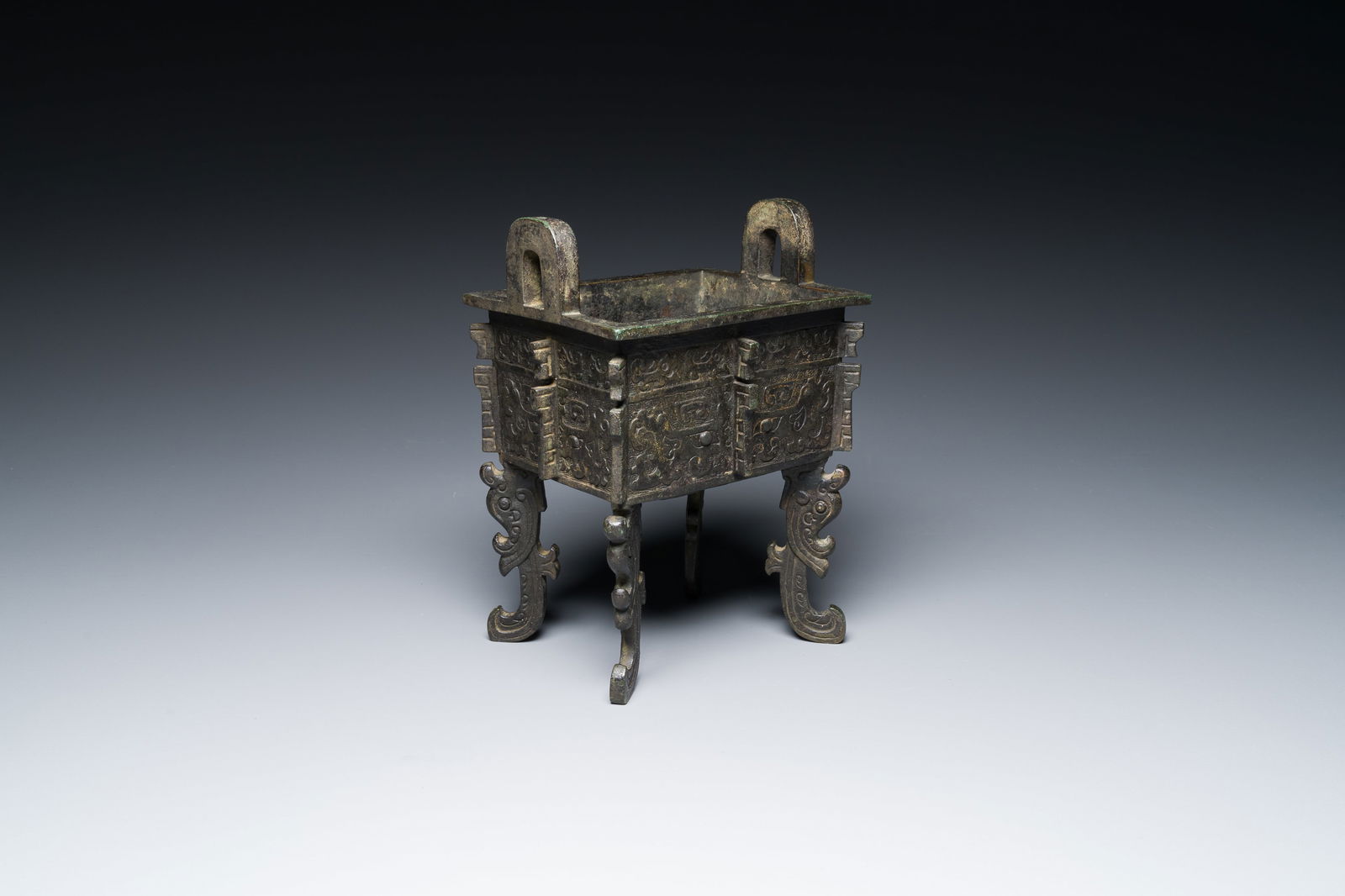 A Chinese archaic bronze ritual food vessel in Western Zhou-style, 'fangding', Bao Ding Zhen Yong (1 of 7)