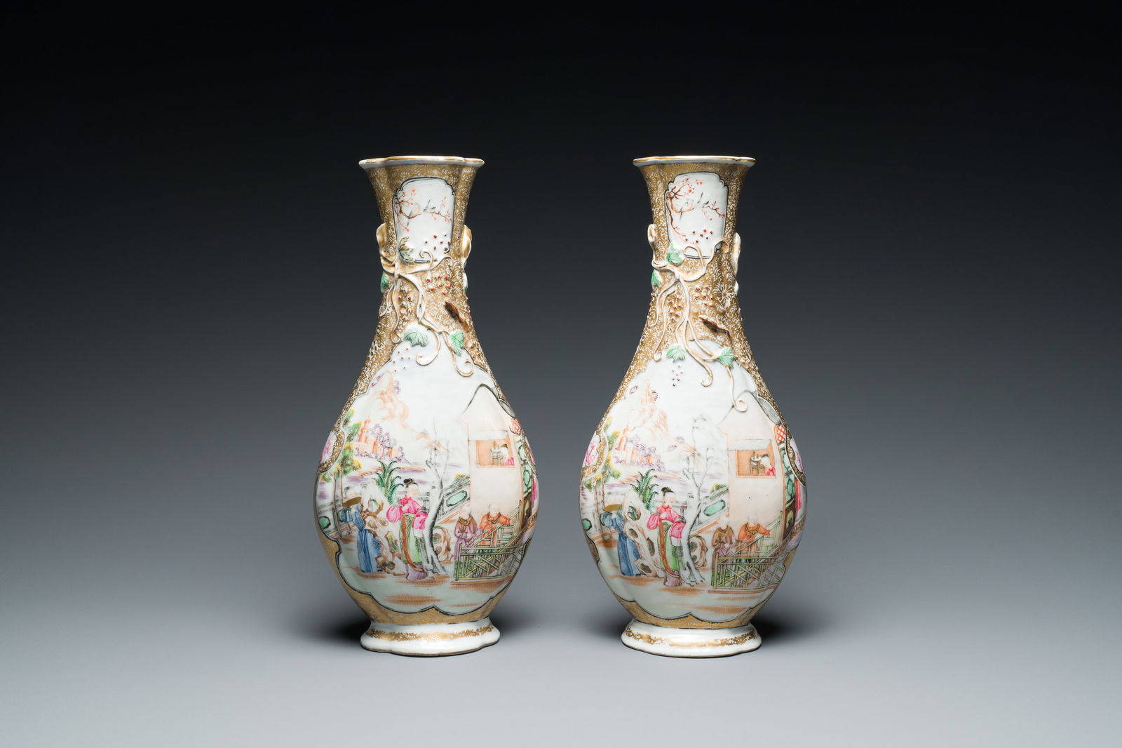 A pair of Chinese famille rose 'mandarin subject' bottle vases, Qianlong (1 of 6)