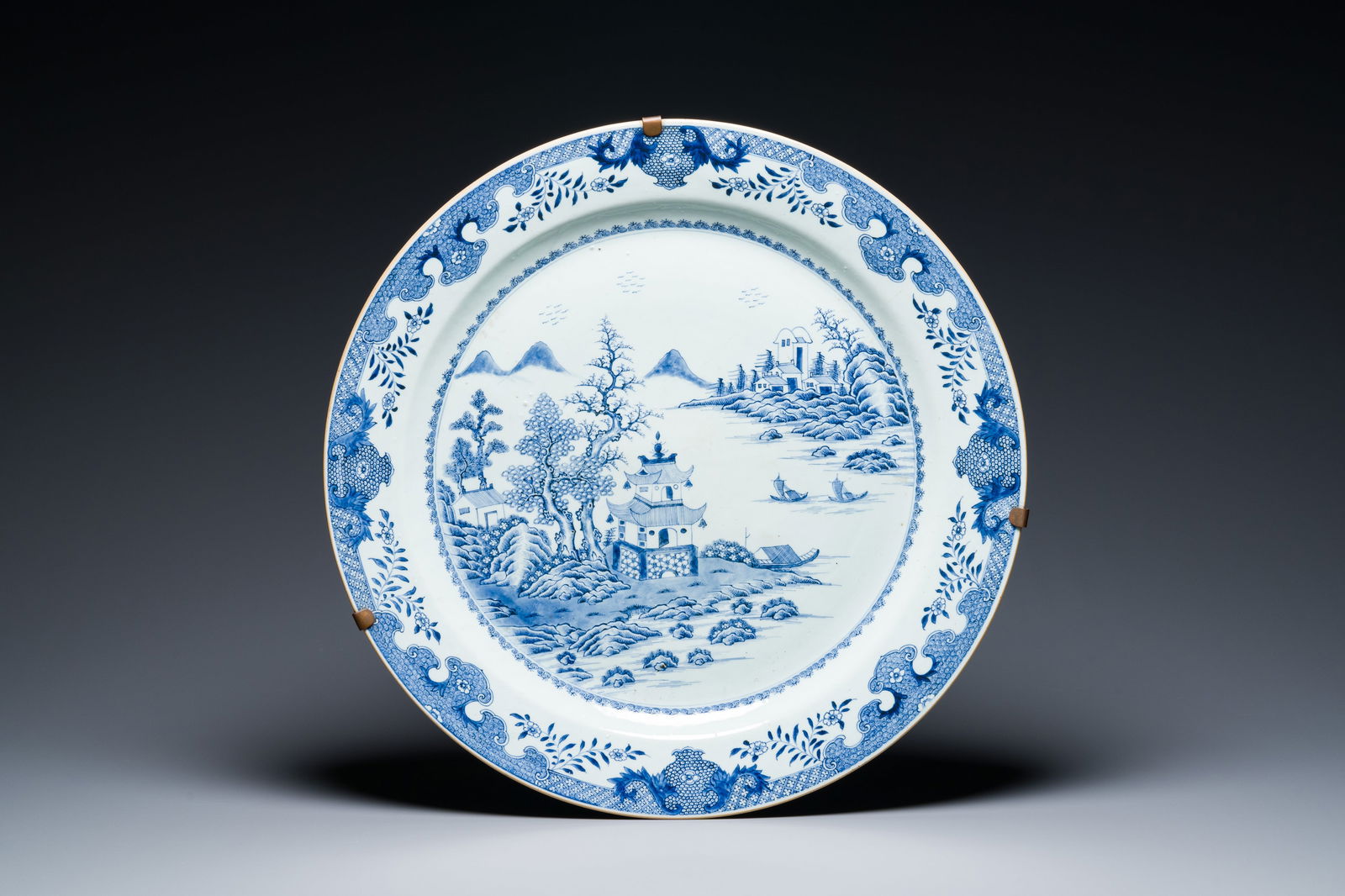 A large Chinese blue and white 'landscape' dish, Qianlong (1 of 2)
