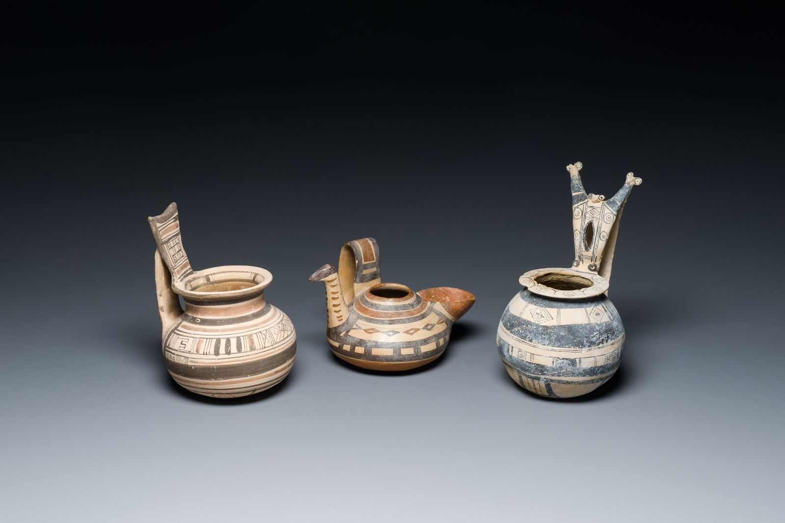 Two geometrical decorated Daunian pottery vessels and an olive press, Southern Italy, 6th/3rd C. (1 of 7)