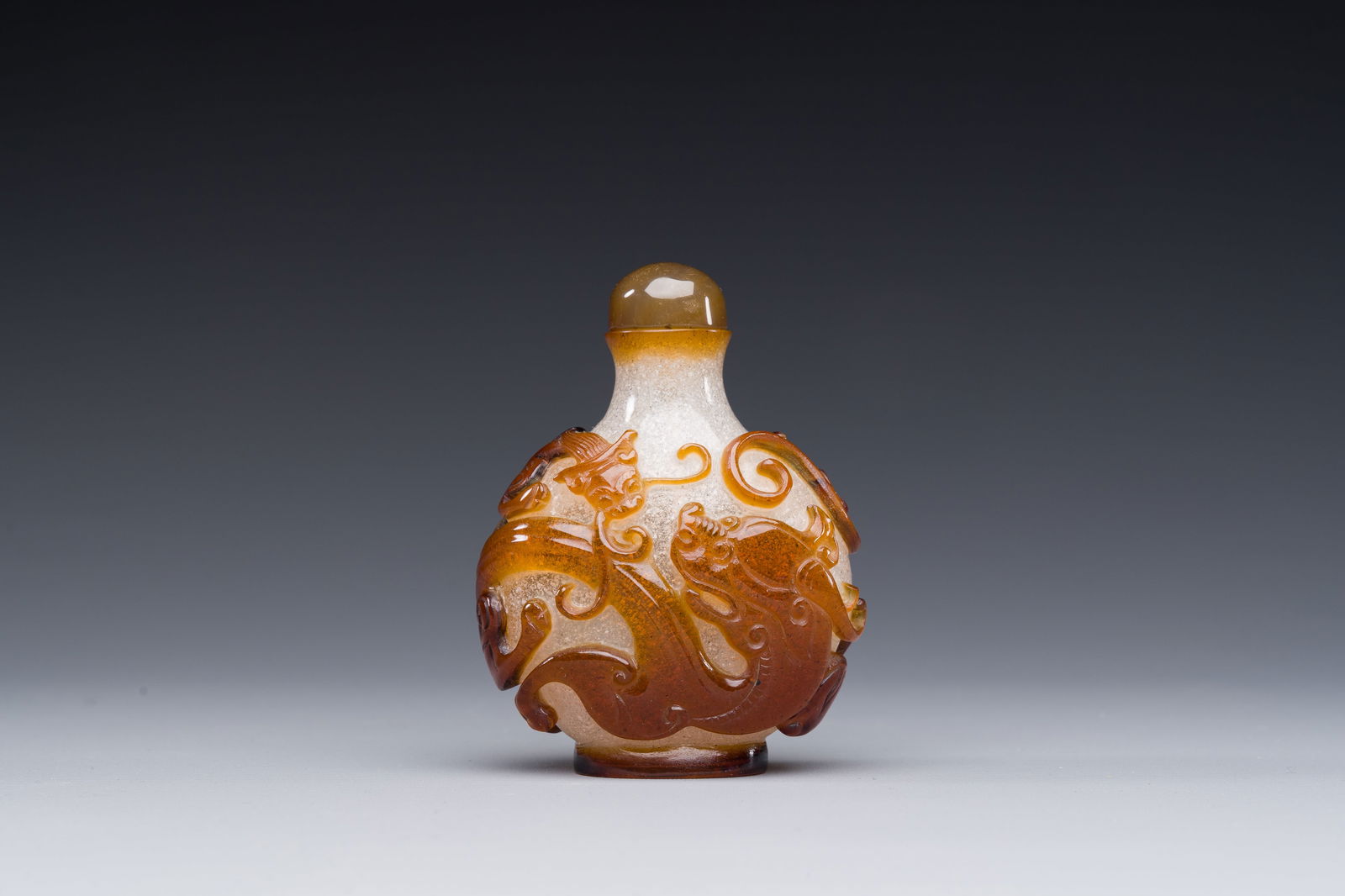 A rare Chinese brown-overlay white glass snuff bottle with chilong design, Qianlong/Jiaqing (1 of 6)