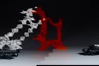 A large Chinese red coral group of female deities on wooden stand, 19/20th C.