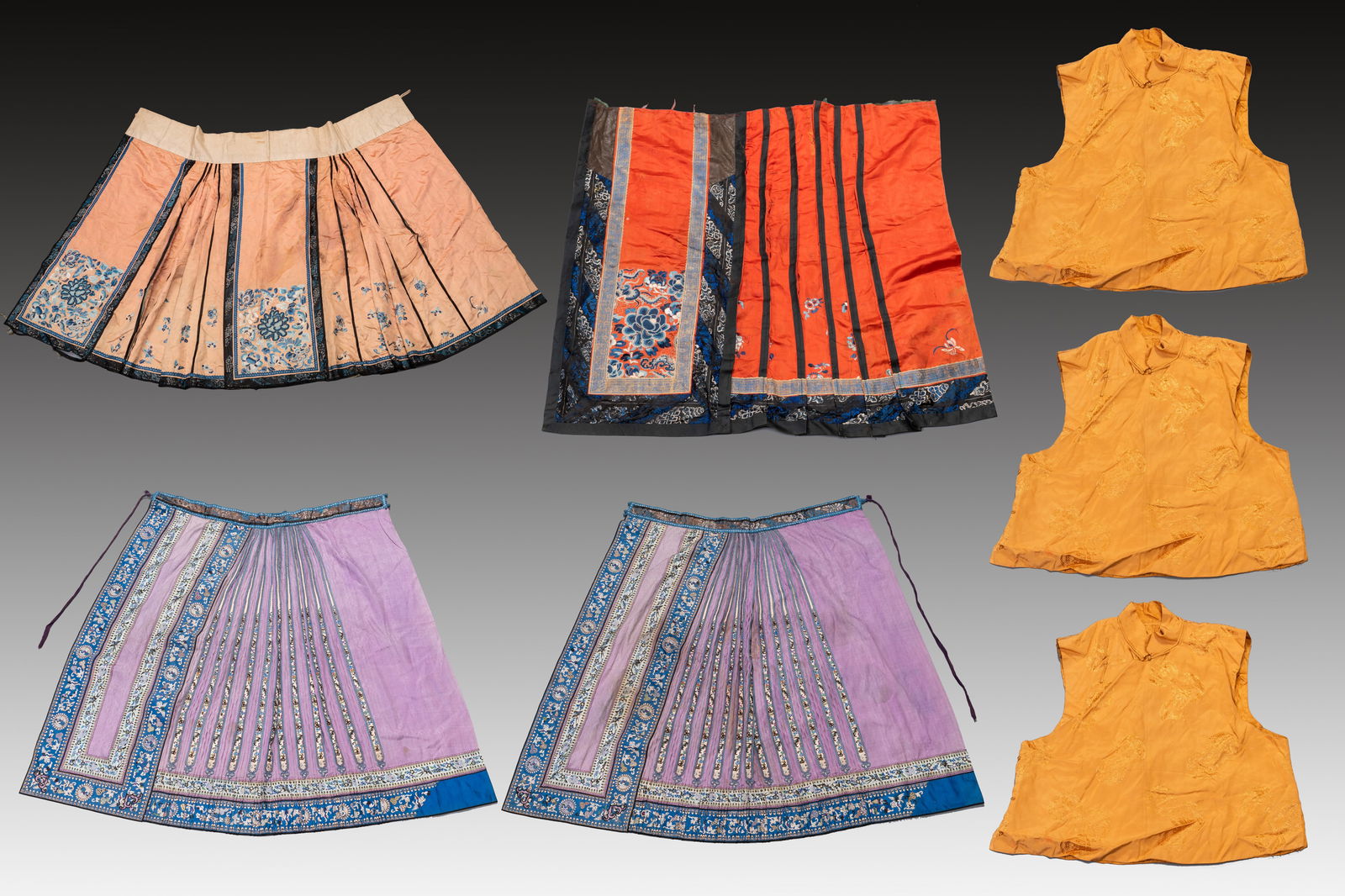 Four Chinese embroidered silk skirts and three yellow 'magua' jackets, 19/20th C. (1 of 1)